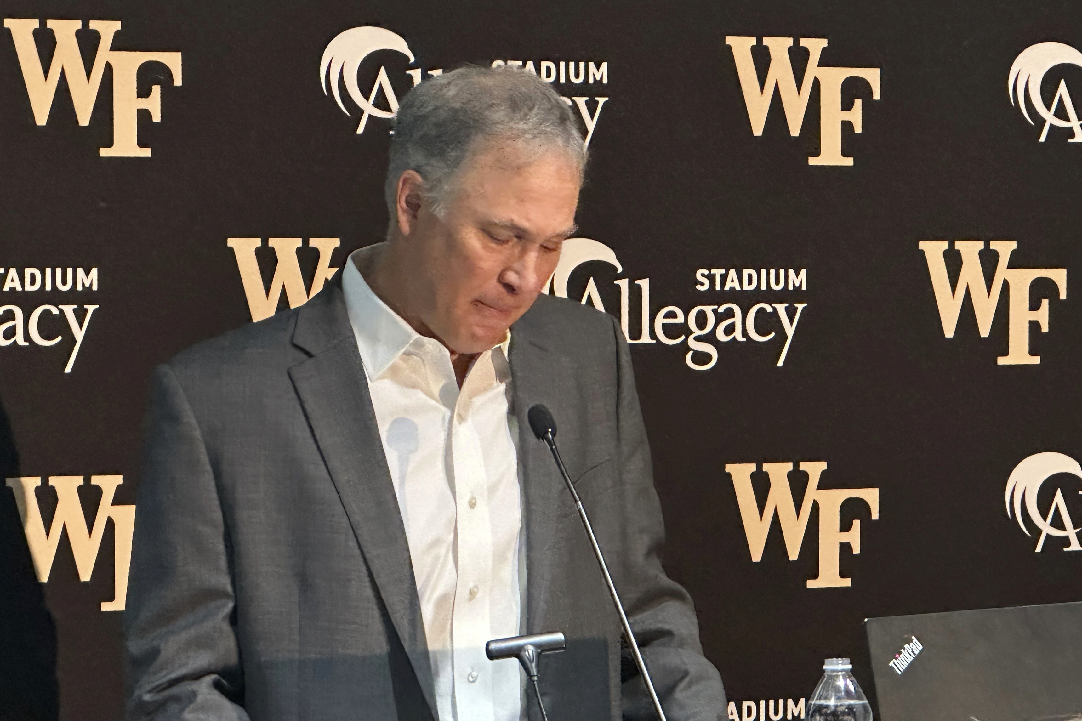 Dave Clawson becomes emotional explaining his decision to resign as head football coach at Wake Forest, Tuesday, Dec. 17, 2024, during an during an NCAA college football news conference in Winston-Salem, N.C.
