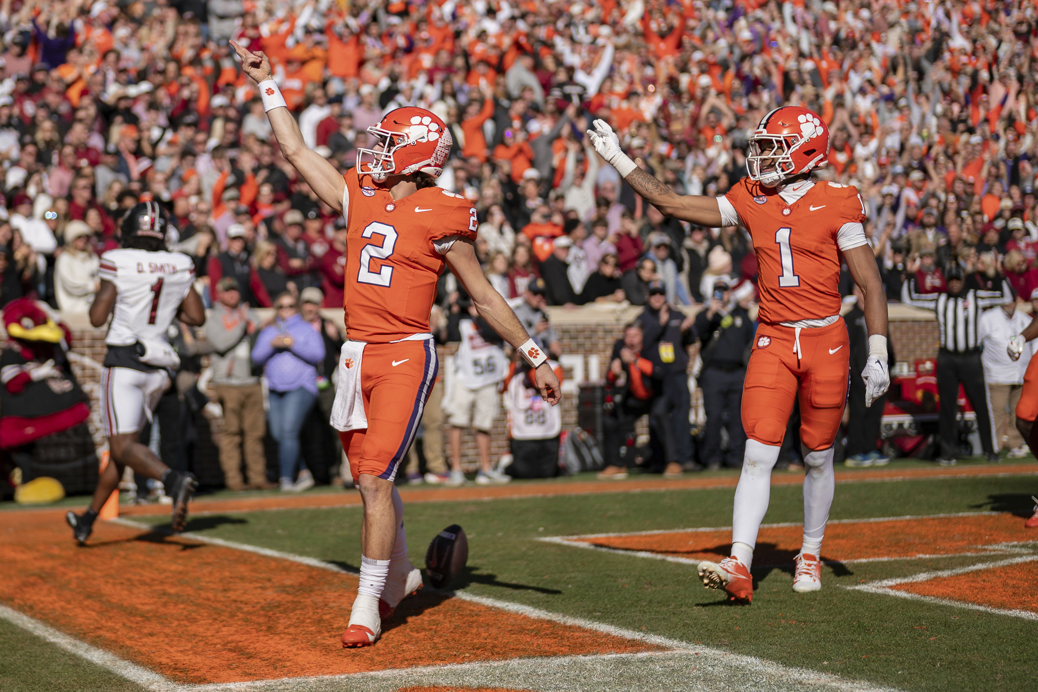 Clemson quarterback Cade Klubnik (2) celebrates his touchdown with wide receiver T.J. Moore (1) in the first half of an NCAA college football game against South Carolina, Saturday, Nov. 30, 2024, in Clemson, S.C. 