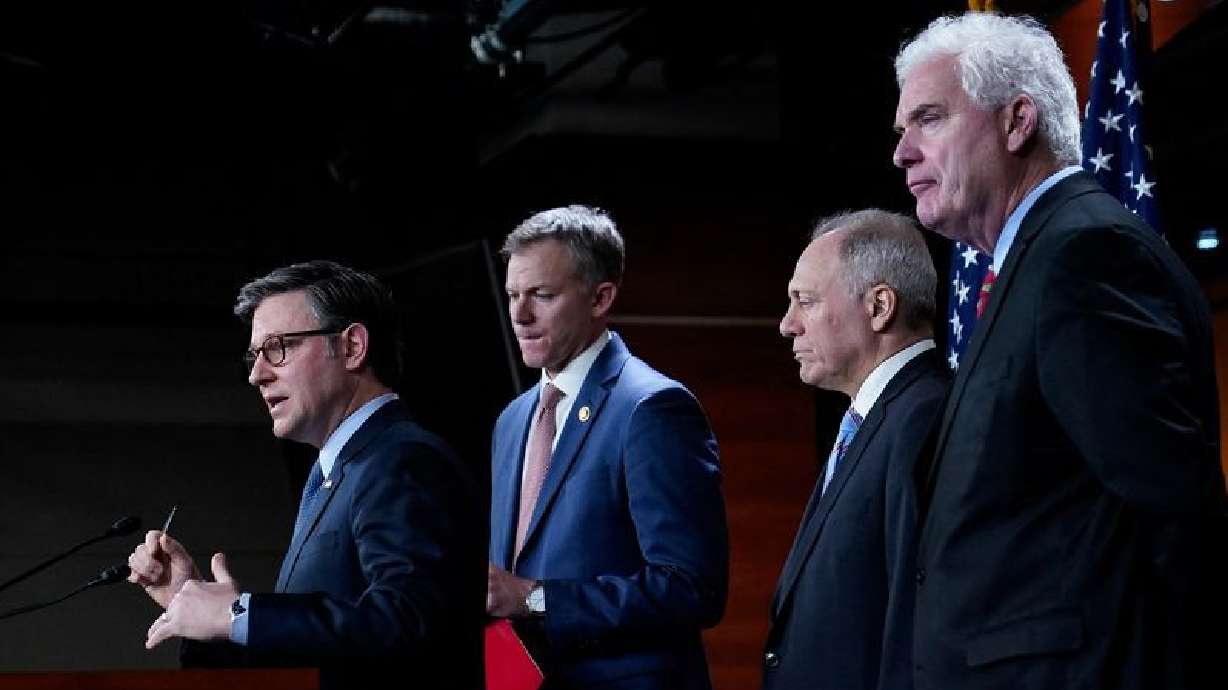 House Speaker Mike Johnson, left, speaks to reporters on Capitol Hill in Washington, Tuesday. Congressional negotiators on Tuesday reached a tentative deal on a stopgap funding bill to avert a partial government shutdown.