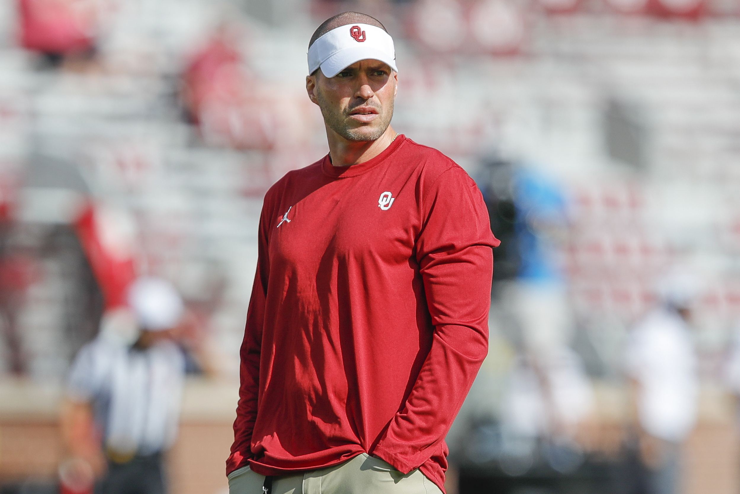 FILE - Oklahoma defensive coordinator Alex Grinch watches before the start of a NCAA college football game against Tulane on Saturday, Sept. 4, 2021, in Norman, Okla. 