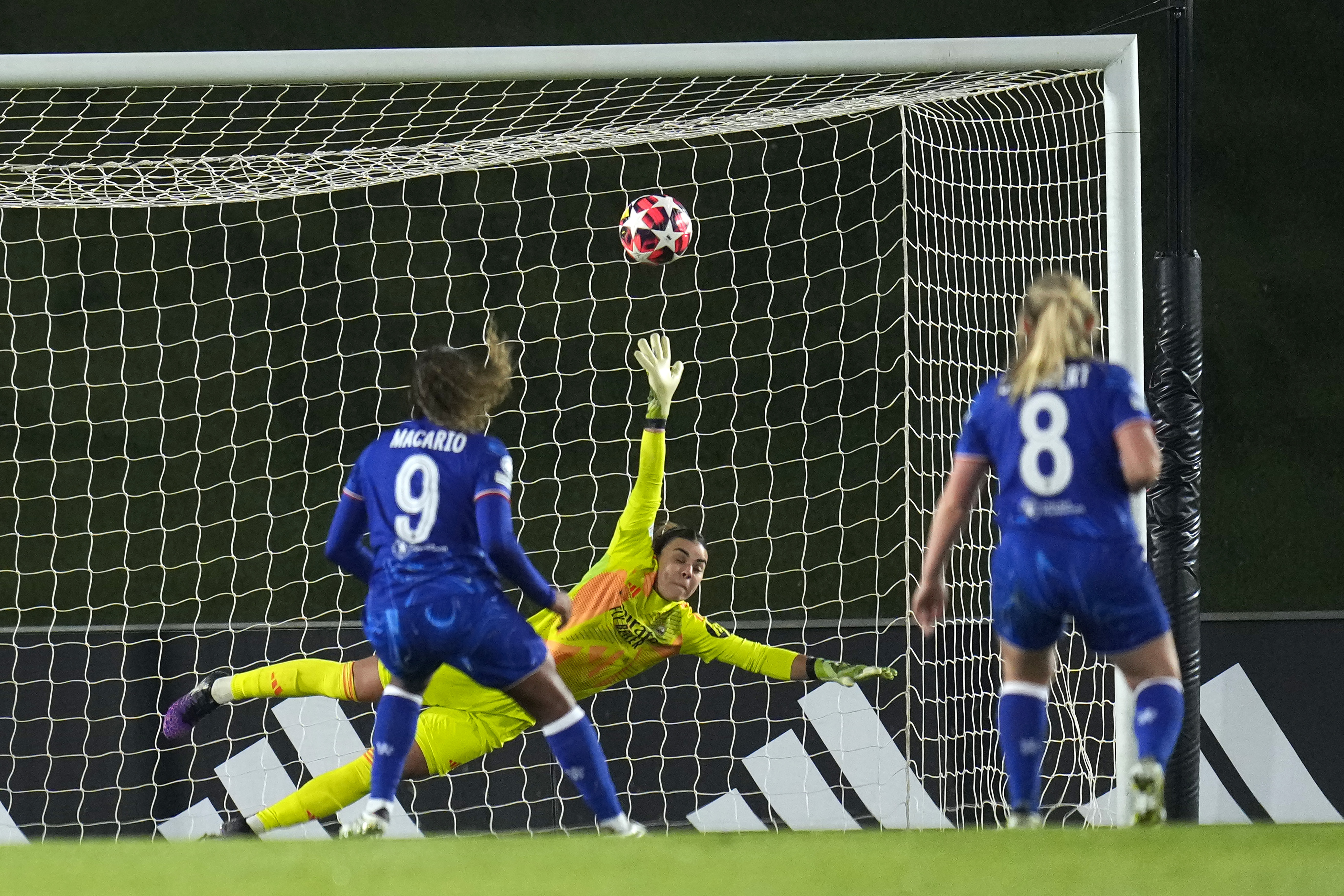 Chelsea's Catarina Macario, left, scores the second goal from penalty during the women's Champions League, group B soccer match between Real Madrid and Chelsea at the Alfredo Di Stefano stadium in Madrid, Spain, Tuesday, Dec. 17, 2024. 