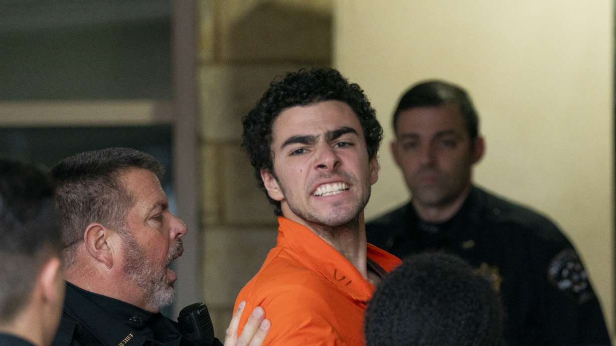 Suspect Luigi Mangione is taken into the Blair County Courthouse on Tuesday, Dec. 10, in Hollidaysburg, Pa. Mangione has been charged with murder as an act of terrorism in connection with the killing of UnitedHealthcare's CEO.