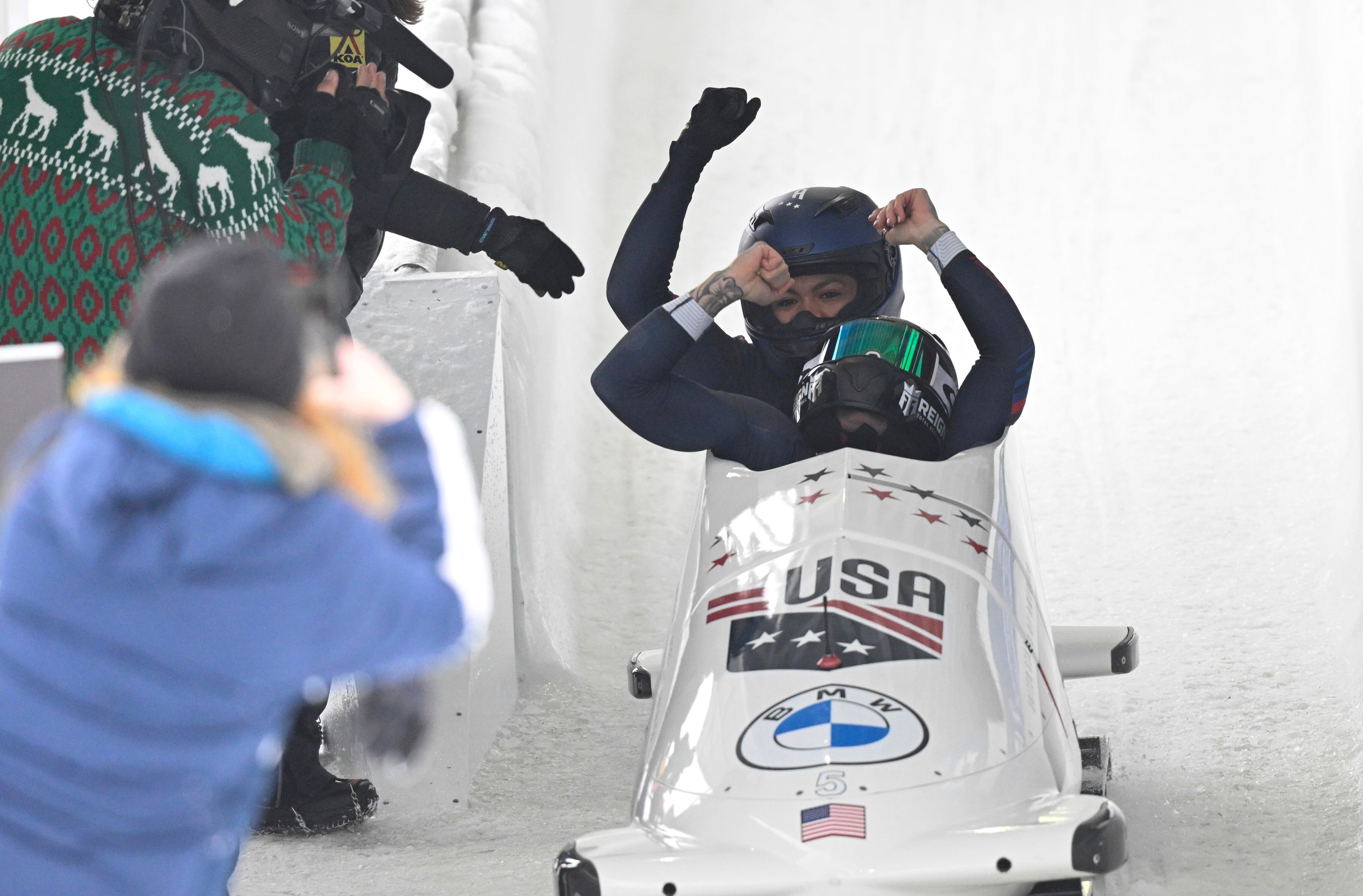 Kaillie Humphries and Kaysha Love of the United States celebrate a first-place finish after the second run of the women's bobsled World Cup race on Sunday in Lake Placid, N.Y.