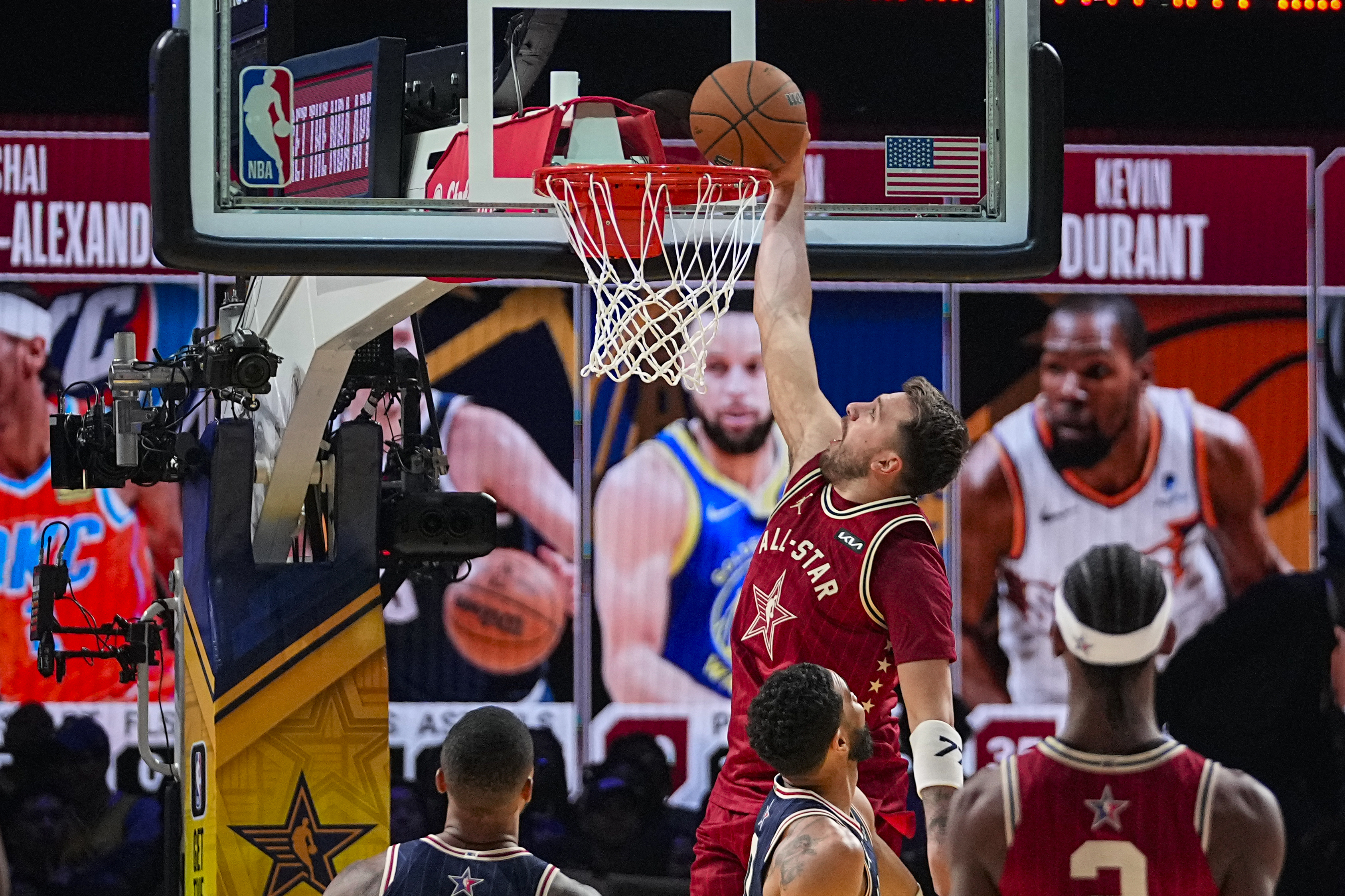 FILE - Dallas Mavericks guard Luka Doncic (77) get a basket on a dunk during the second half of an NBA All-Star basketball game in Indianapolis, Sunday, Feb. 18, 2024. 