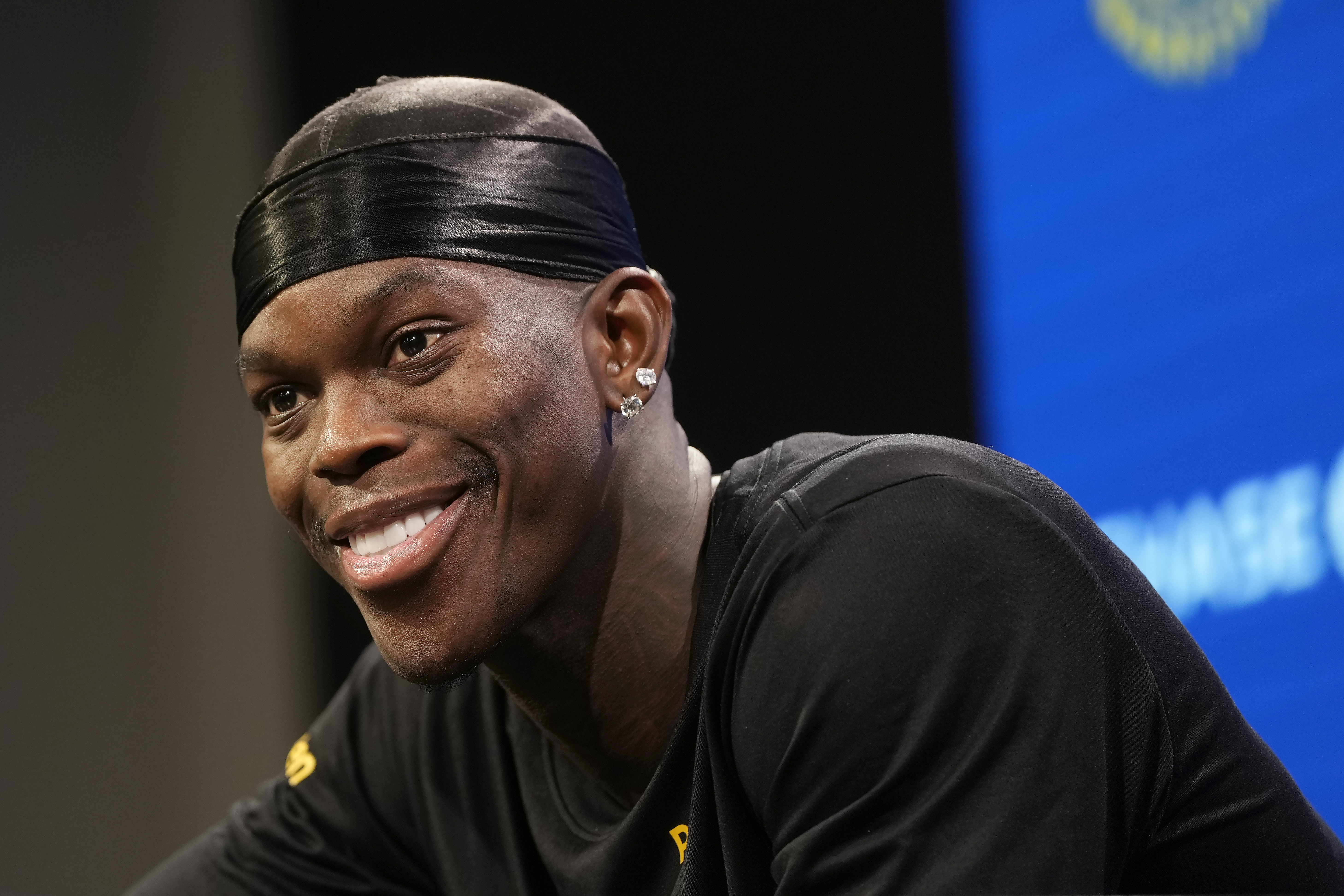 Golden State Warriors guard Dennis Schroder speaks at a news conference at the NBA basketball team's facility in San Francisco, Tuesday, Dec. 17, 2024. 