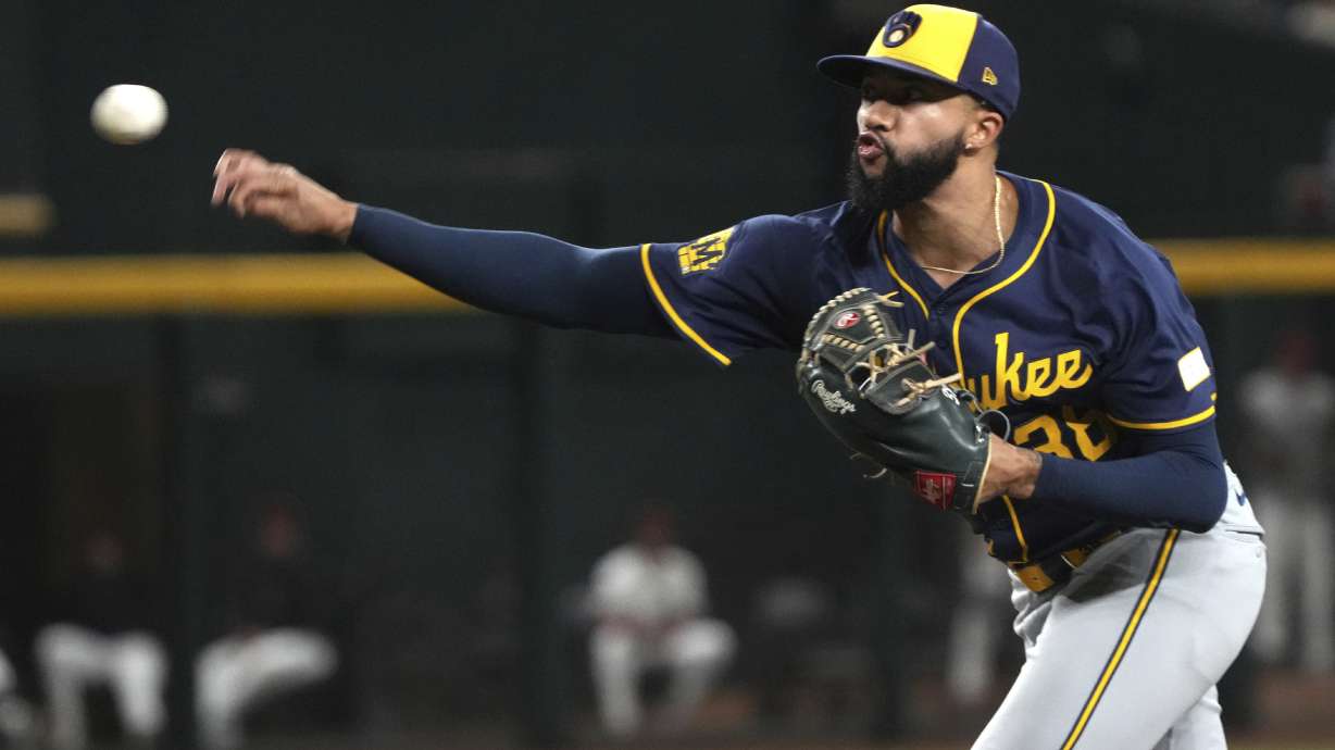 FILE - Milwaukee Brewers pitcher Devin Williams throws against the Arizona Diamondbacks in the ninth inning during a baseball game, Friday, Sept. 13, 2024, in Phoenix.