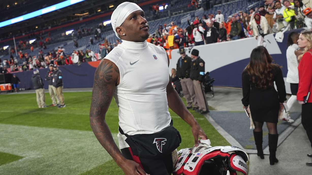 Atlanta Falcons quarterback Michael Penix Jr. heads off the field after an NFL football game, Sunday, Nov. 17, 2024, in Denver.