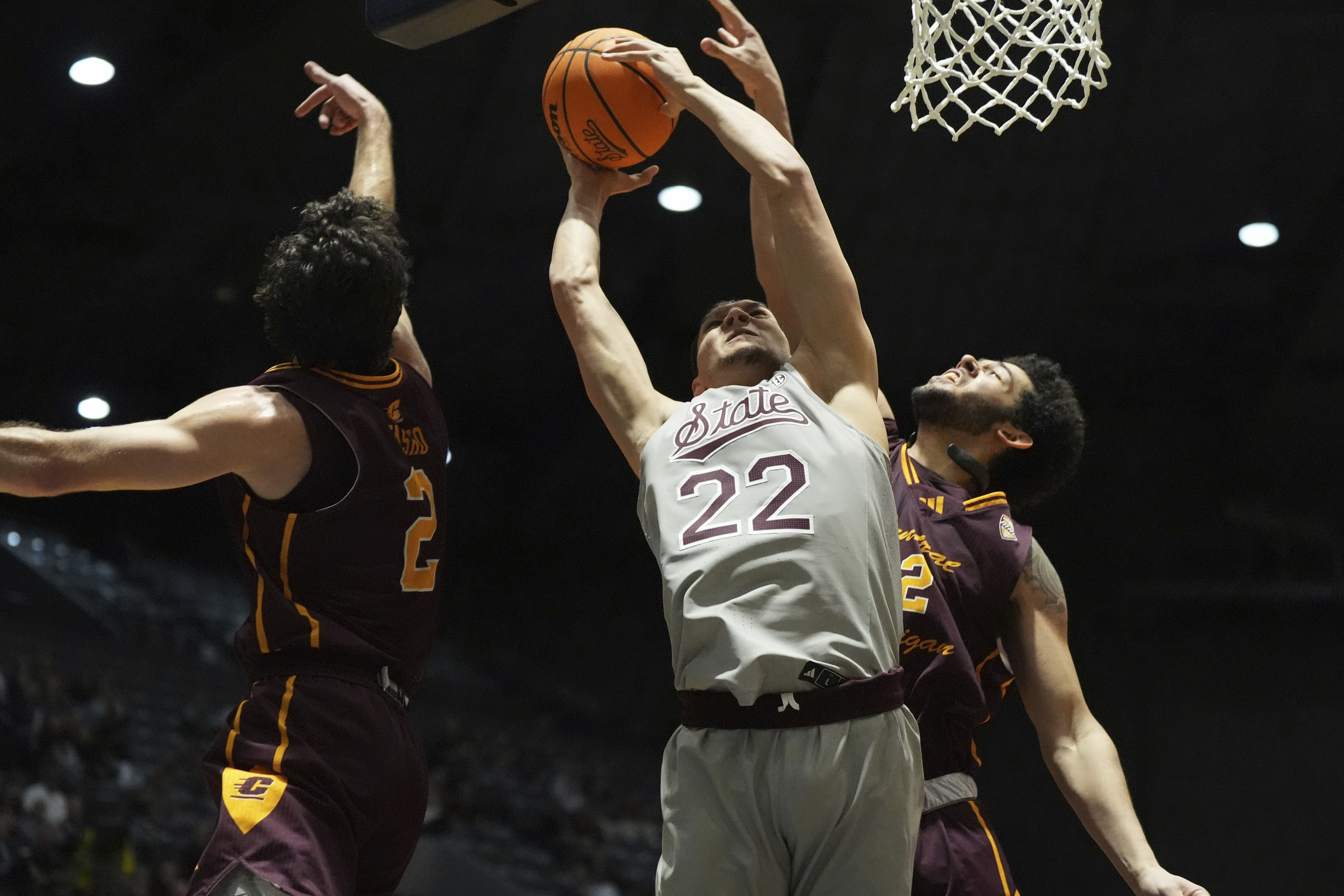 Mississippi State forward RJ Melendez (22) attempts a layup past a block attempt by Central Michigan center Hunter Harding (12) during the first half of an NCAA college basketball game, Tuesday, Dec. 17, 2024, in Jackson, Miss.