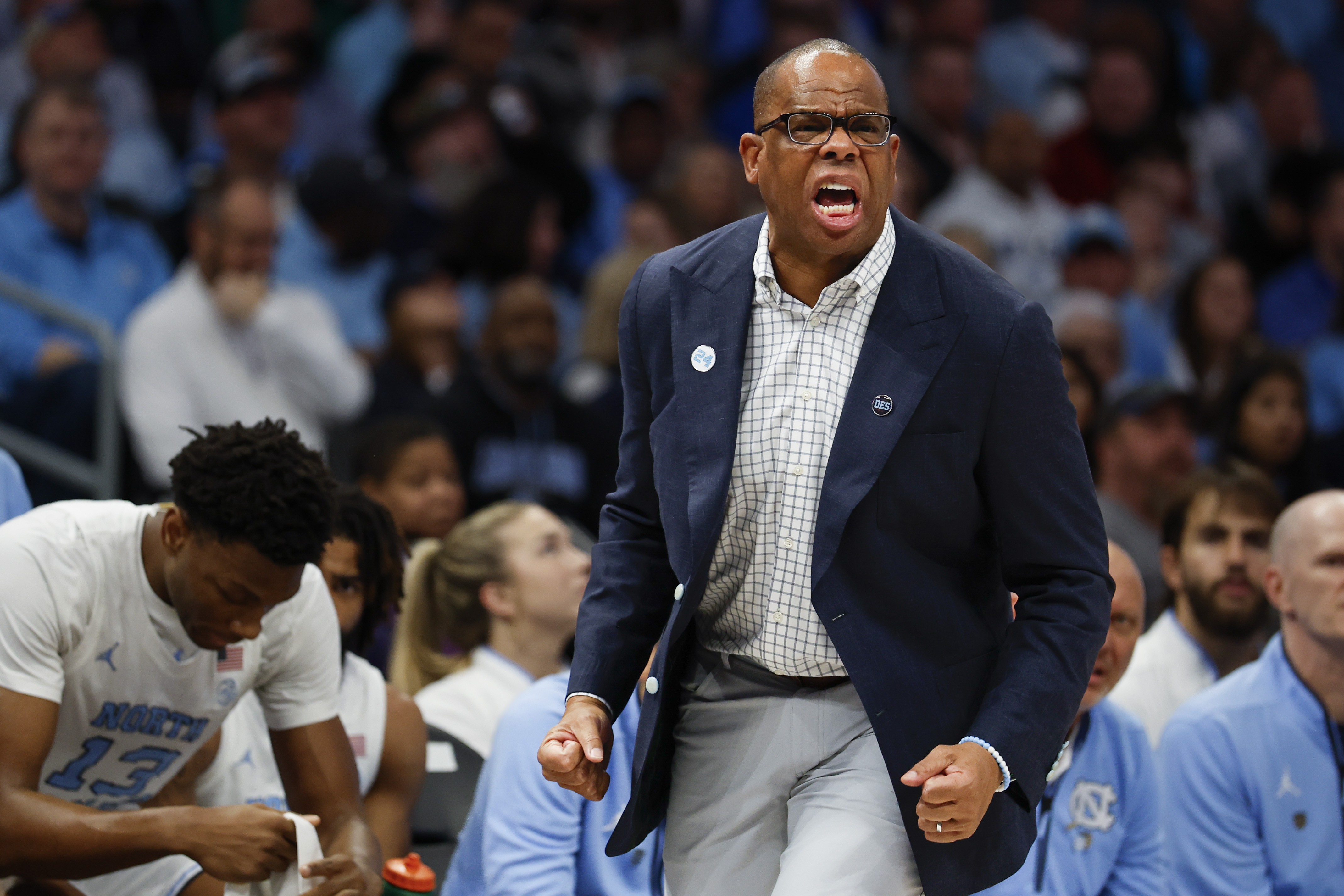 North Carolina head coach Hubert Davis yells too his team during the first half of an NCAA college basketball game against Florida in Charlotte, N.C., Tuesday, Dec. 17, 2024.