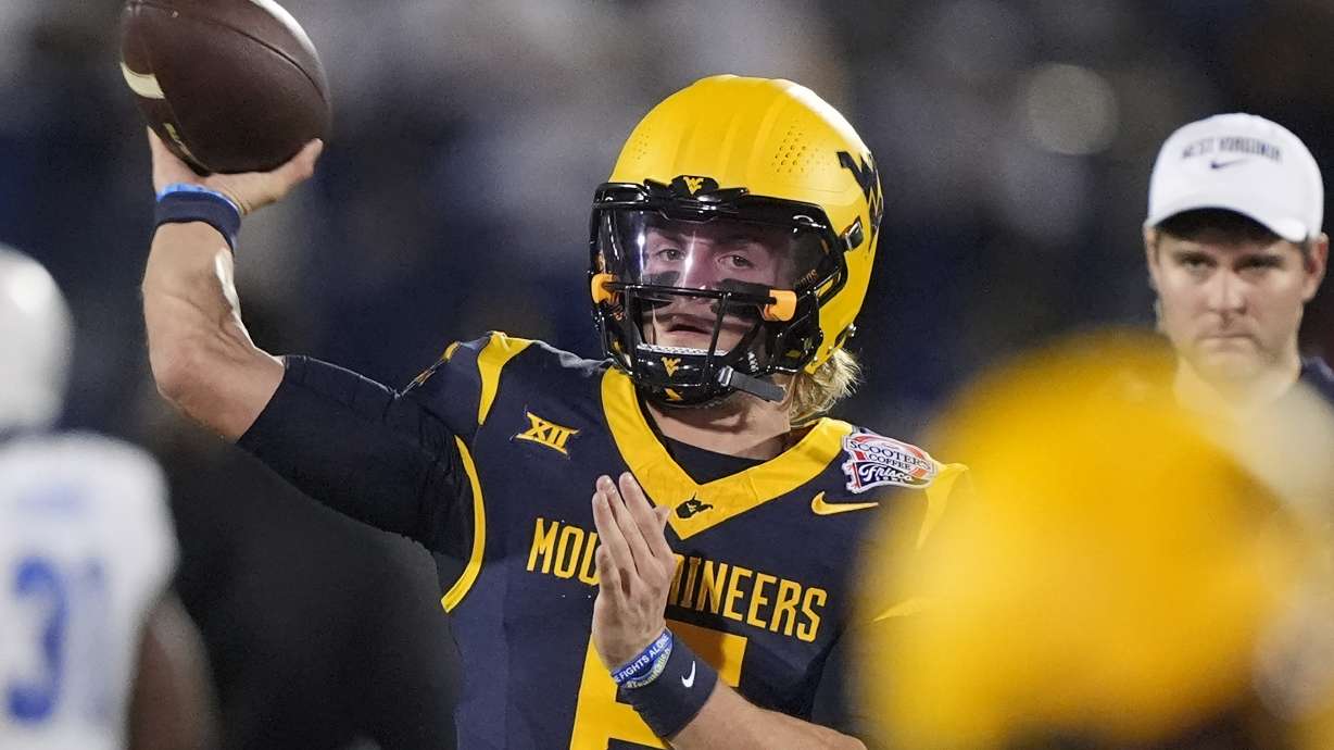 West Virginia quarterback Nicco Marchiol (8) warms up before the Frisco Bowl NCAA college football game against Memphis Tuesday, Dec. 17, 2024, in Frisco, Texas.