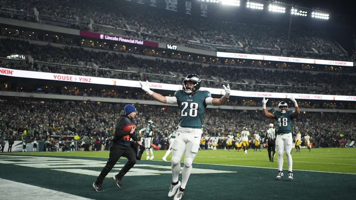 Philadelphia Eagles running back Will Shipley (28) gestures to the crowd with Eagles fullback Khari Blasingame (48) during the second half of an NFL football game against the Pittsburgh Steelers on Sunday, Dec. 15, 2024, in Philadelphia.