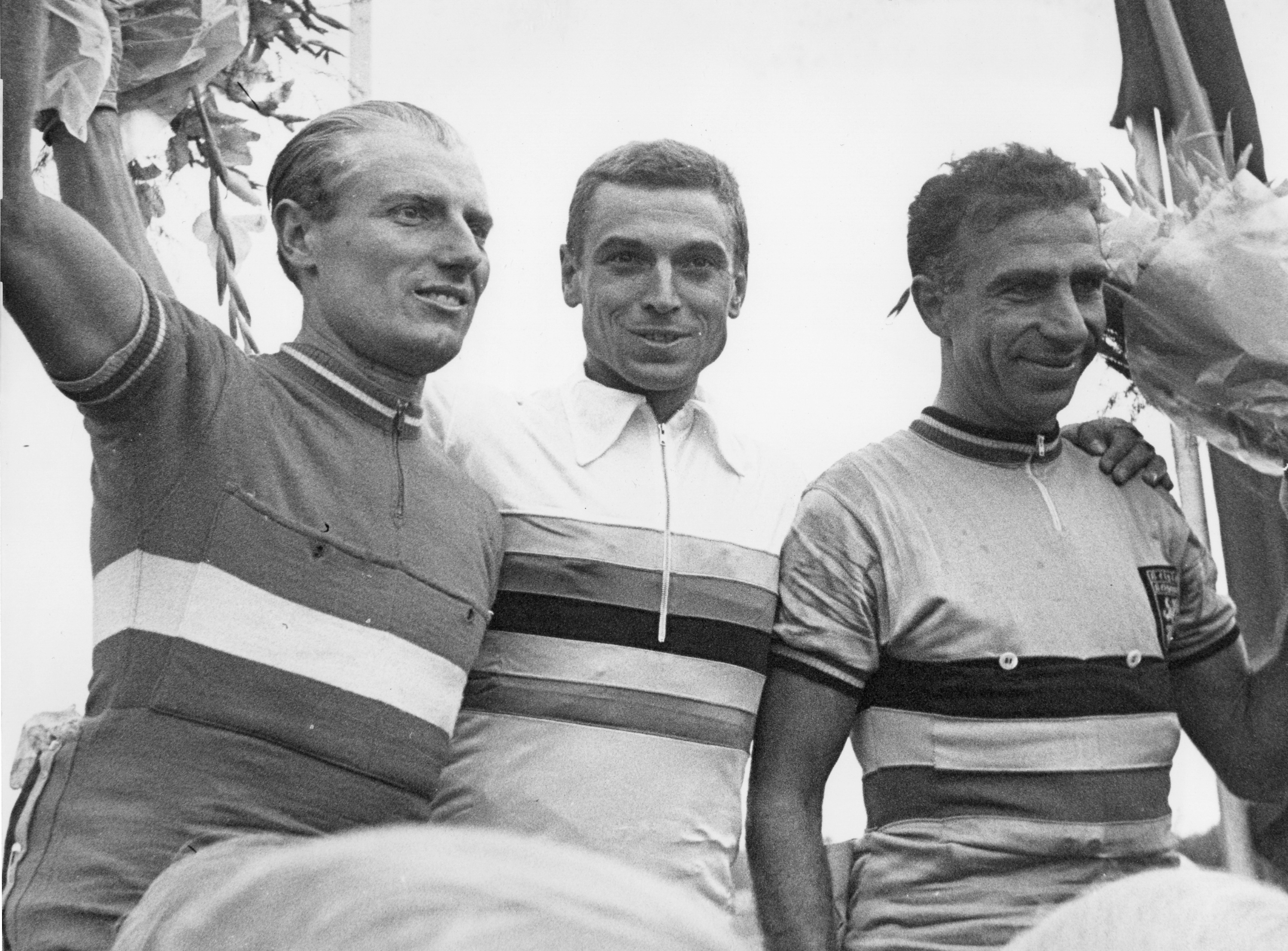 FILE - Belgian cyclist Rik van Looy, center, on the winner's podium in Hohenstein-Ernstthal, West Germany, August 14, 1960. 