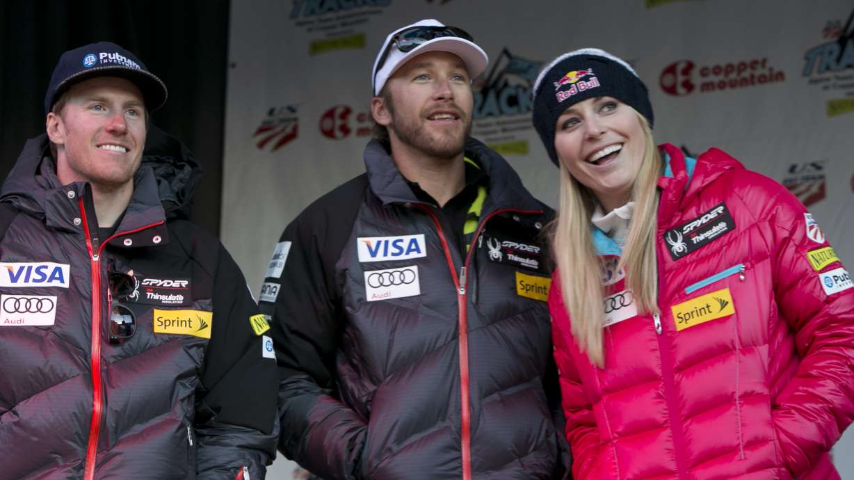 FILE - Ted Ligety, left, Bode Miller, Lindsey Vonn stand together at a U.S. Ski Team event at Copper Mountain, Colo., on Friday, Nov. 8, 2013.