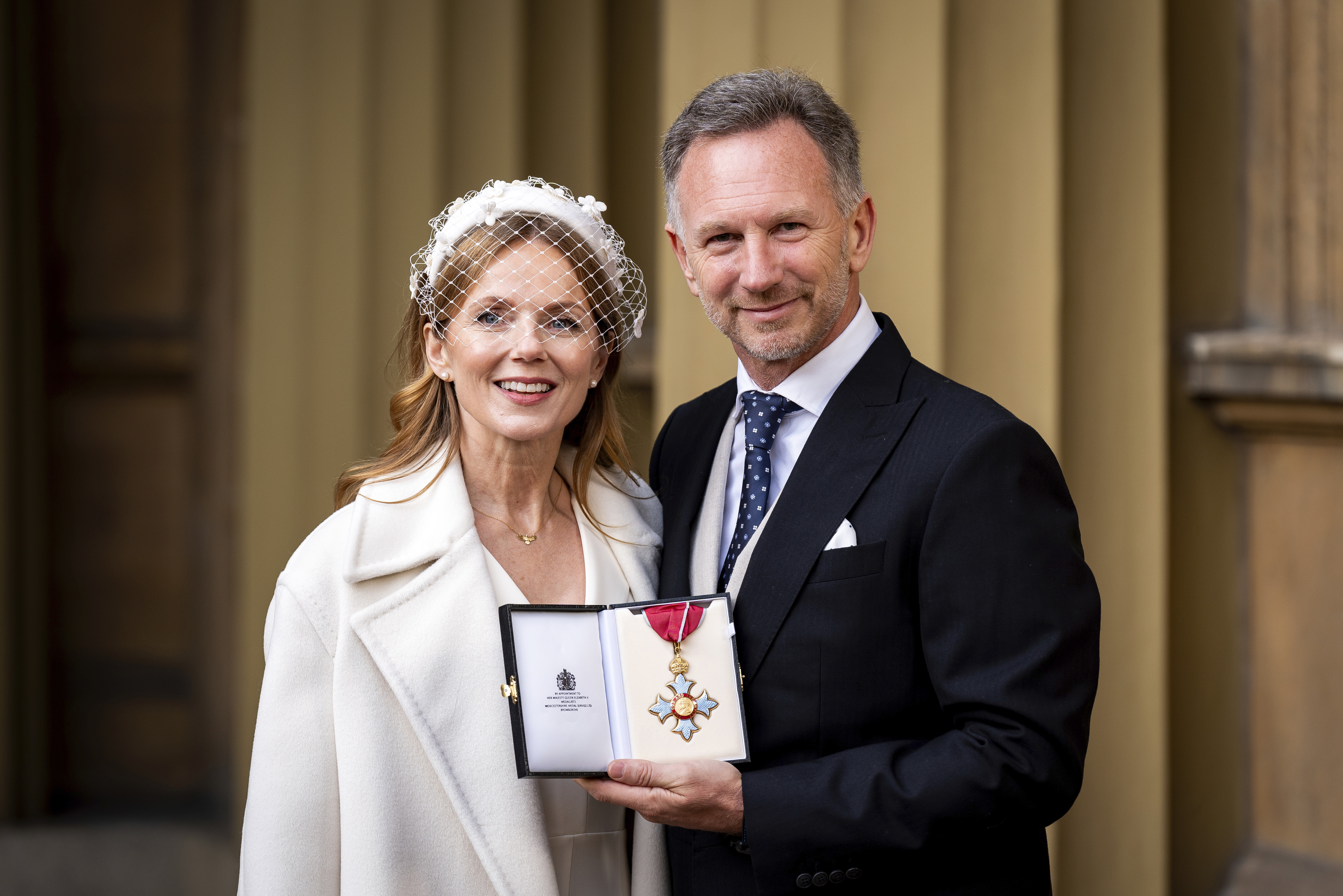 Team Principal and Chief Executive Officer of Red Bull Racing Christian Horner, right, poses with his wife wife Geri Horner after being made a Commander of the Order of the British Empire at an Investiture ceremony at Buckingham Palace in London, Wednesday Dec. 18, 2024.