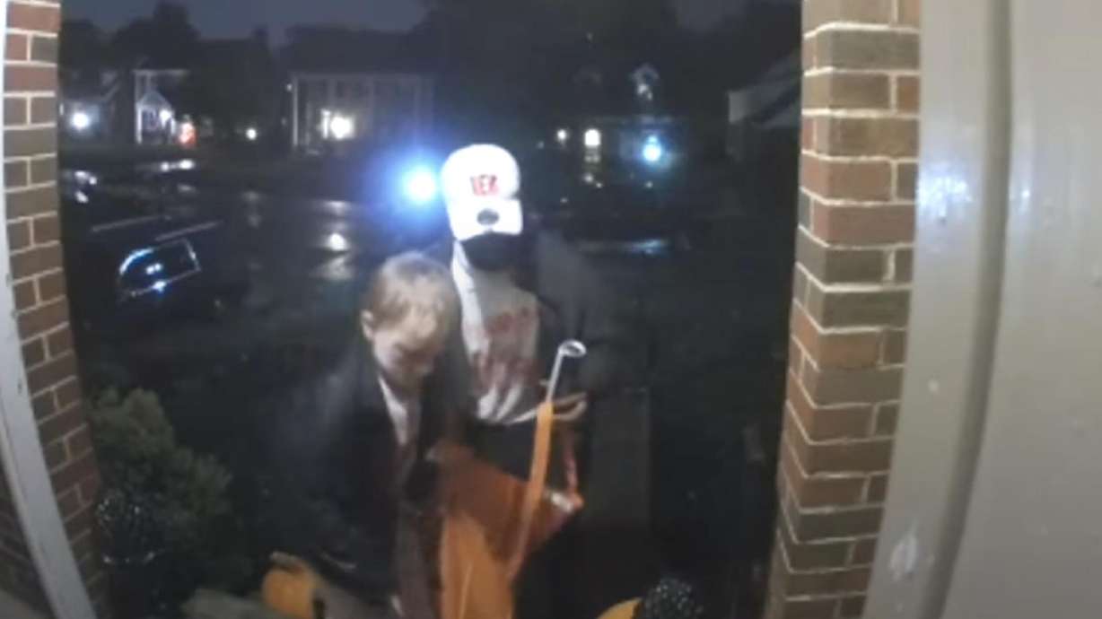 A trick-or-treater gives back when he sees a Halloween bowl is empty.