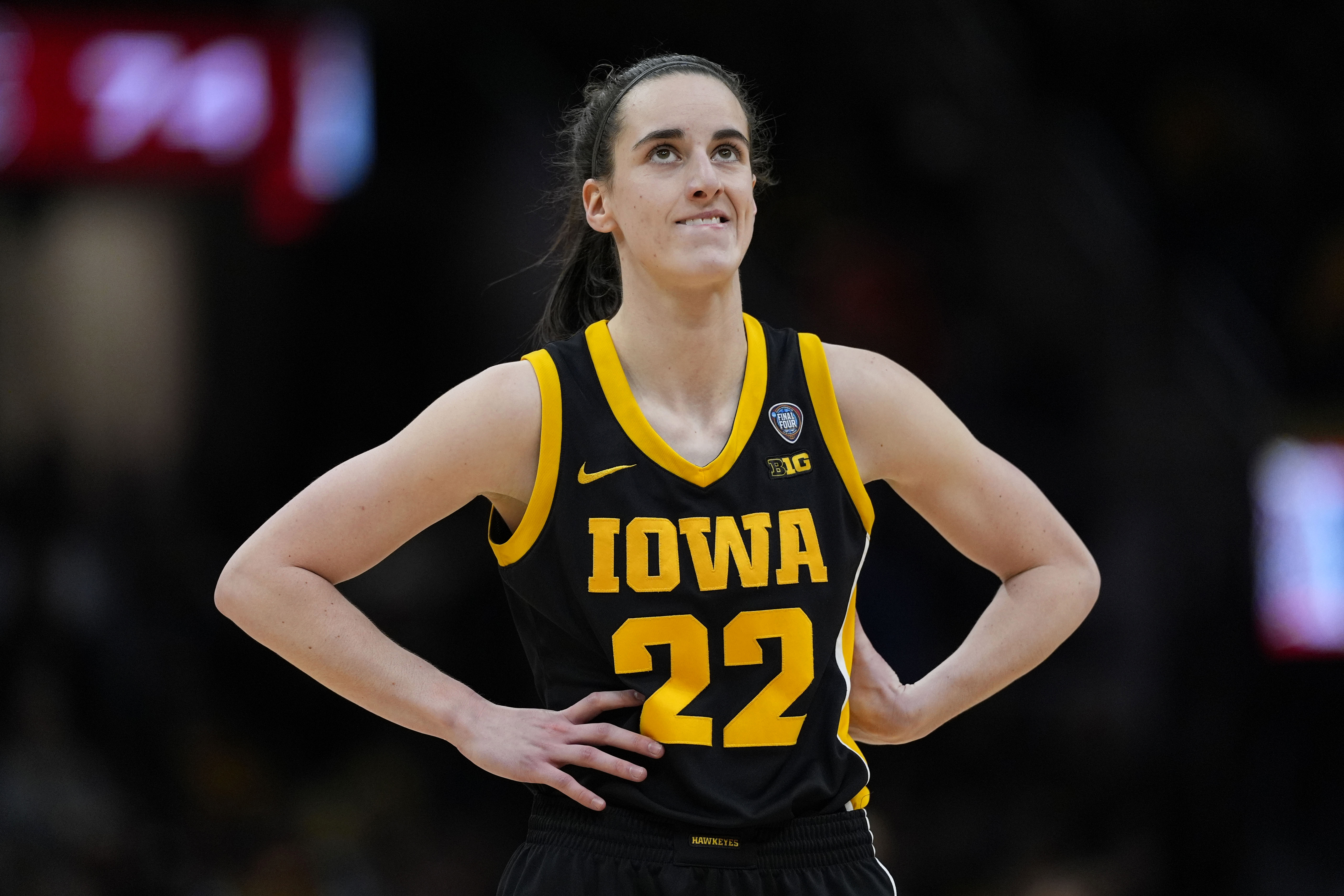 FILE -Iowa guard Caitlin Clark stands on the court during the second half of the Final Four college basketball championship game against South Carolina in the women's NCAA Tournament, Sunday, April 7, 2024, in Cleveland. 