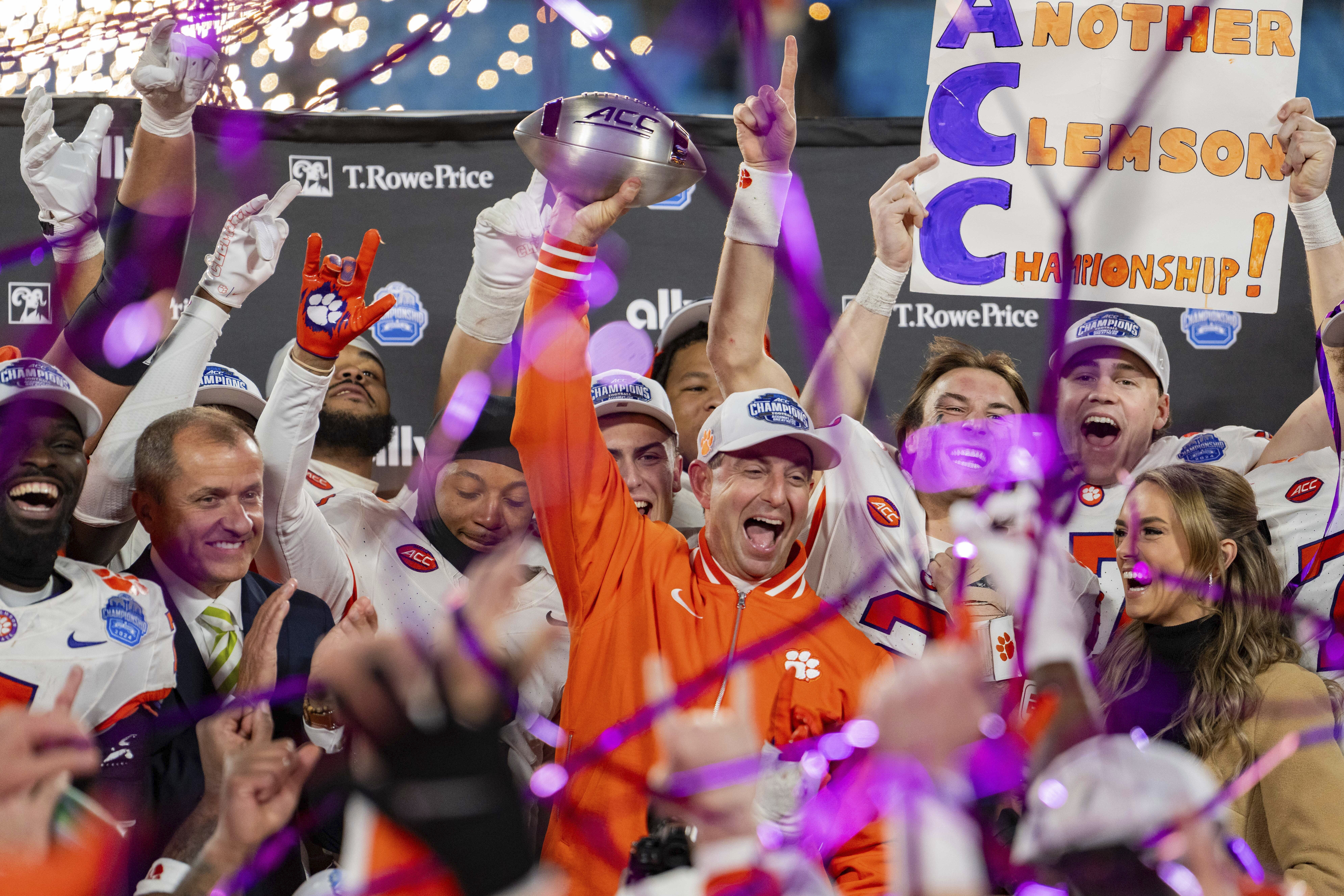 Clemson head coach Dabo Swinney celebrates with the trophy after defeating SMU during the Atlantic Coast Conference championship NCAA college football game Saturday, Dec. 7, 2024, in Charlotte, N.C. 