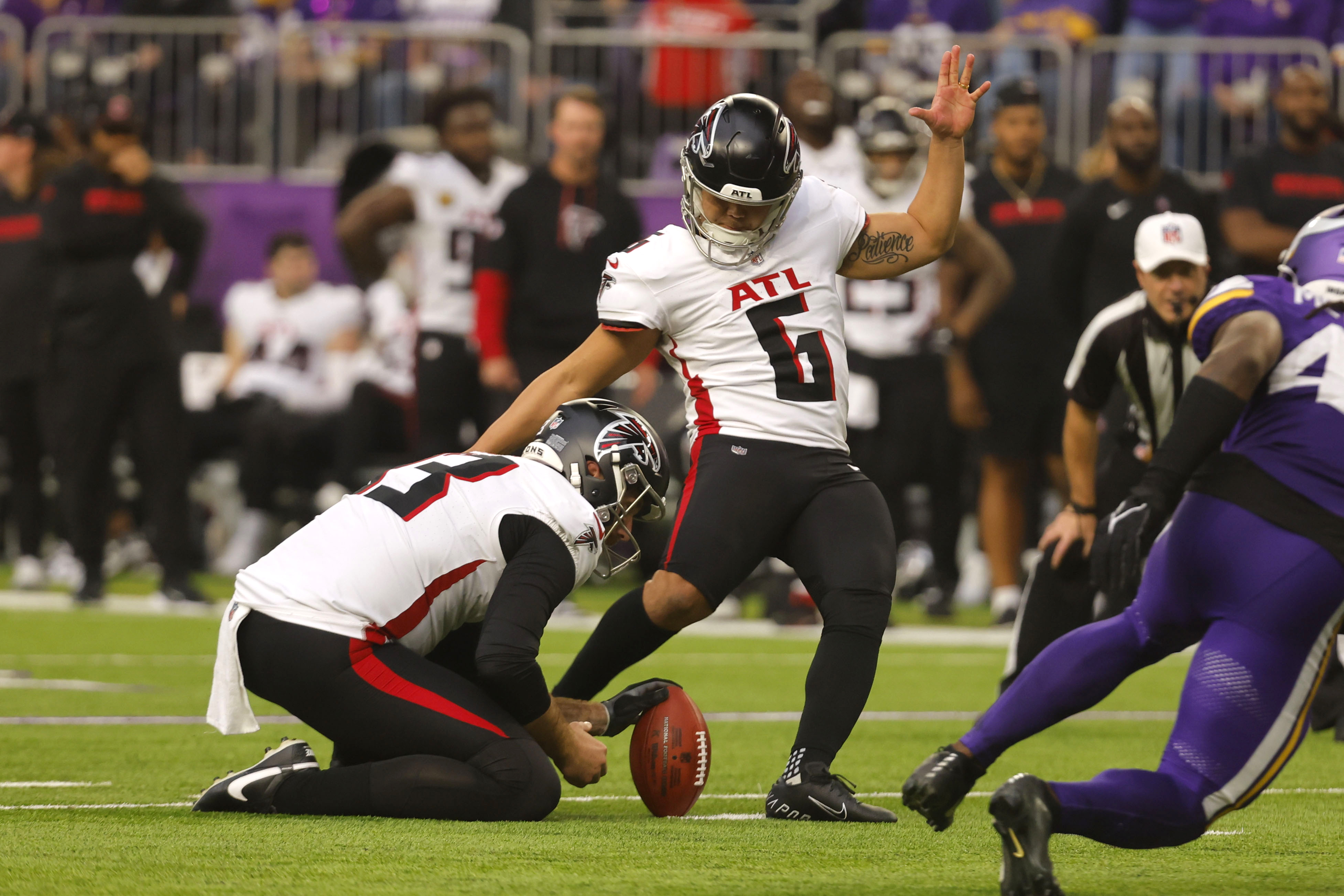 Atlanta Falcons place kicker Younghoe Koo (6) kicks a 29-yard field goal during the second half of an NFL football game against the Minnesota Vikings, Sunday, Dec. 8, 2024, in Minneapolis. 