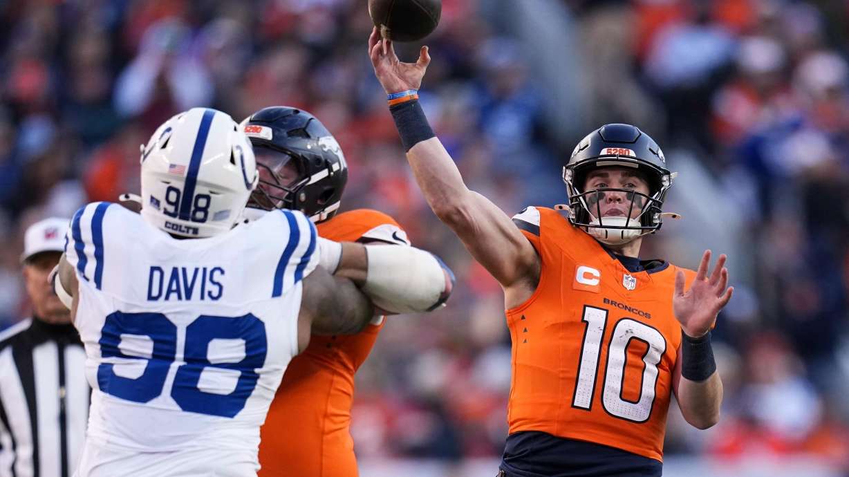 Denver Broncos' Bo Nix throws during the first half of an NFL football game against the Indianapolis Colts Sunday, Dec. 15, 2024, in Denver.