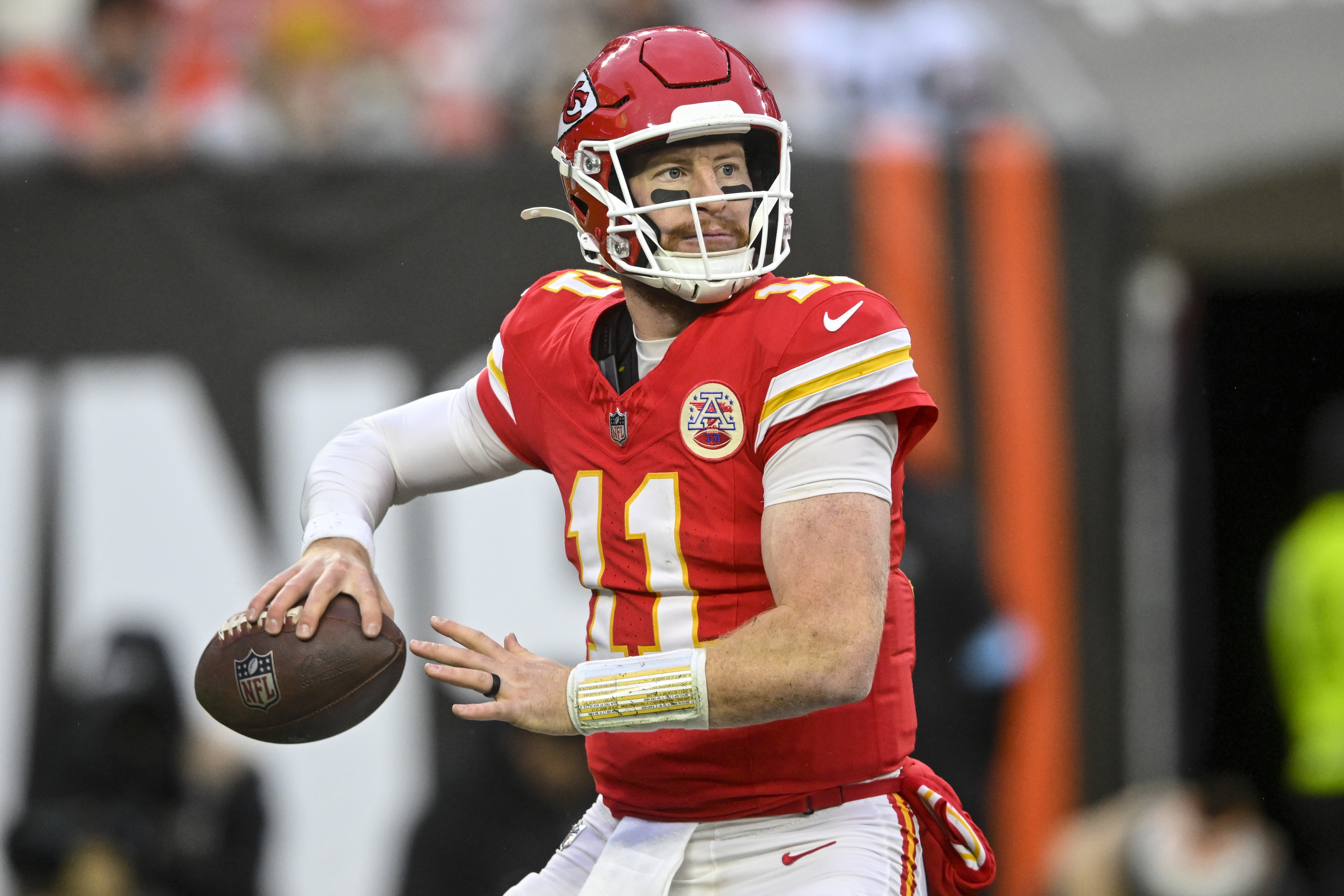 Kansas City Chiefs quarterback Carson Wentz (11) passes in the pocket against the Cleveland Browns during the second half of an NFL football game, Sunday, Dec. 15, 2024, in Cleveland. 