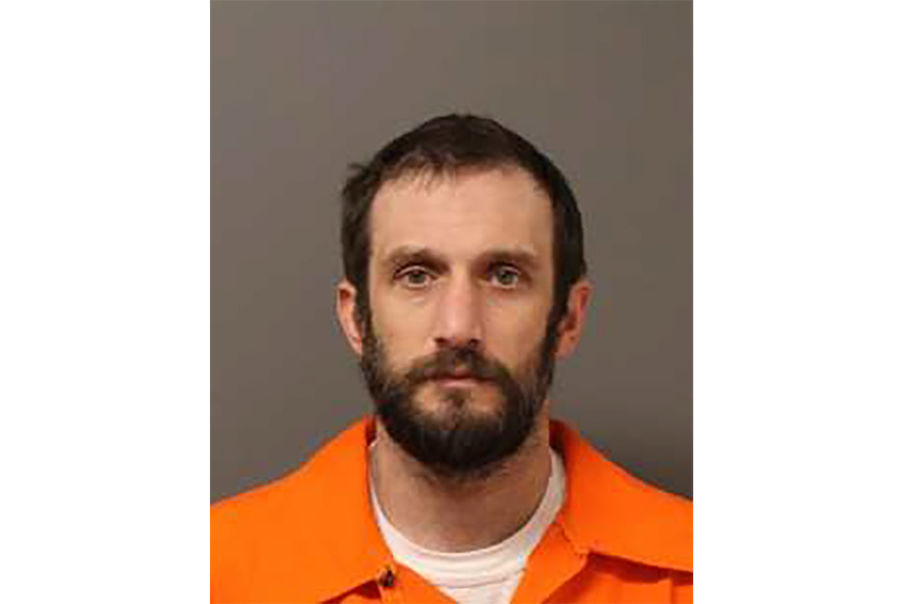 FILE - This photo provided by University of Connecticut police shows booking photo of Robert Parmalee, charged with stalking and harassing UConn basketball star Paige Bueckers. 