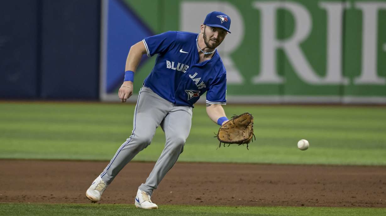 FILE - Toronto Blue Jays first baseman Spencer Horwitz reaches for an infield grounder during a baseball game against the Tampa Bay Rays Saturday, Sept. 21, 2024, in St. Petersburg, Fla.