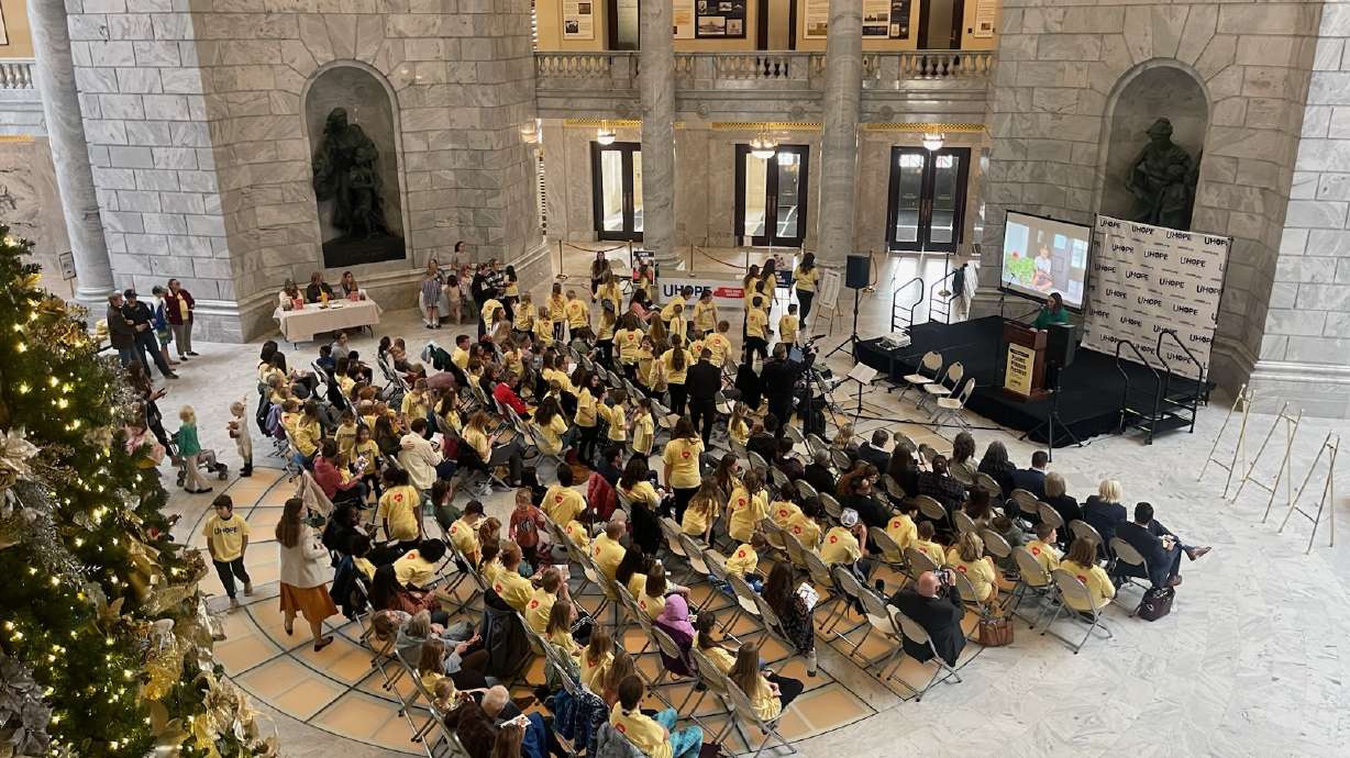 Parents, students and educators listen to Britany Sproul, chairwoman of the Utah Home-education Organizations for Parental Empowerment Coalition and homeschooling mom of eight years, speak about homeschooling rights at the Utah State Capitol on Wednesday.