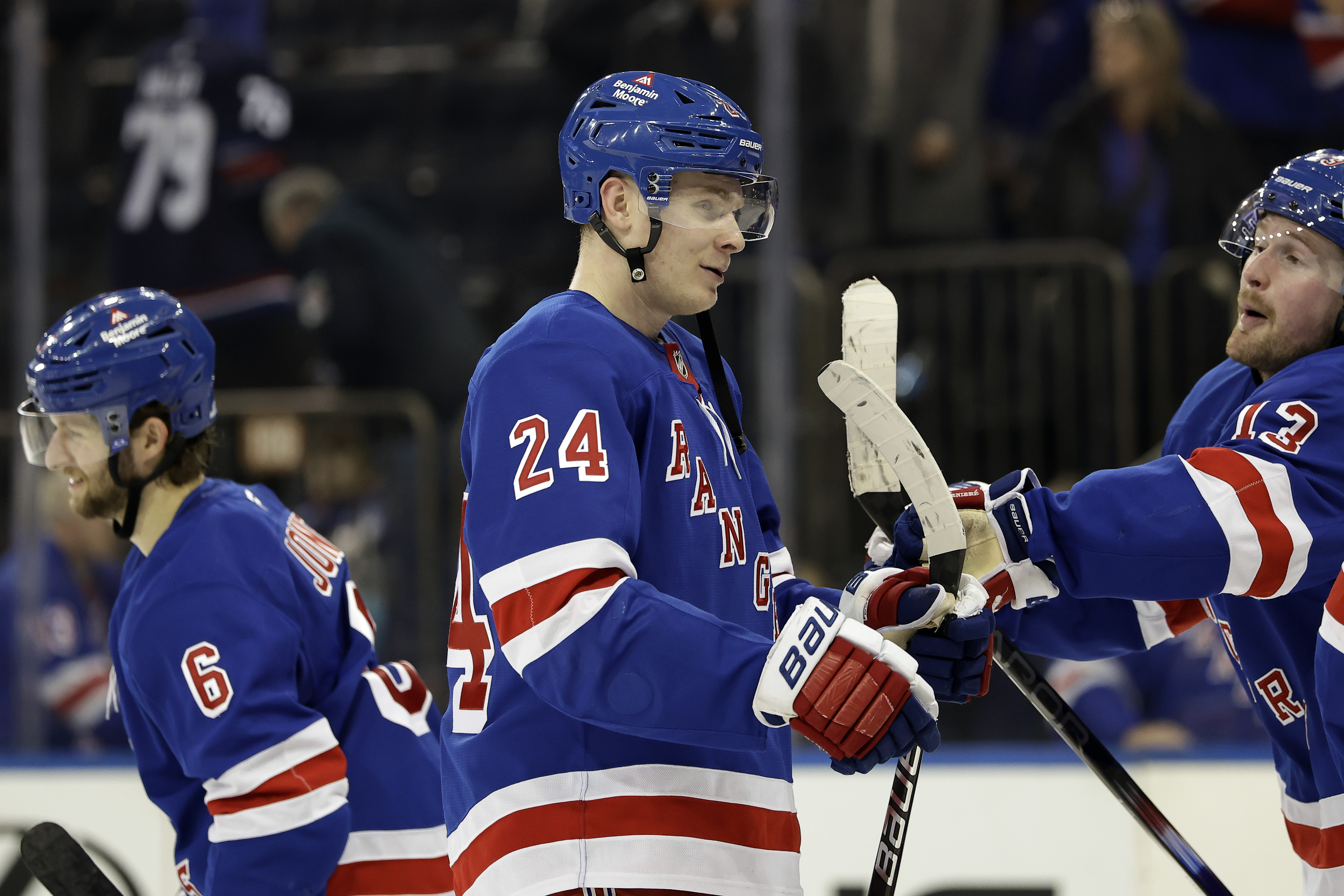 New York Rangers right wing Kaapo Kakko (24) is congratulated by Alexis Lafrenière (13) after the third period of an NHL hockey game against the Montreal Canadiens Saturday, Nov. 30, 2024, in New York. The Rangers won 4-3.