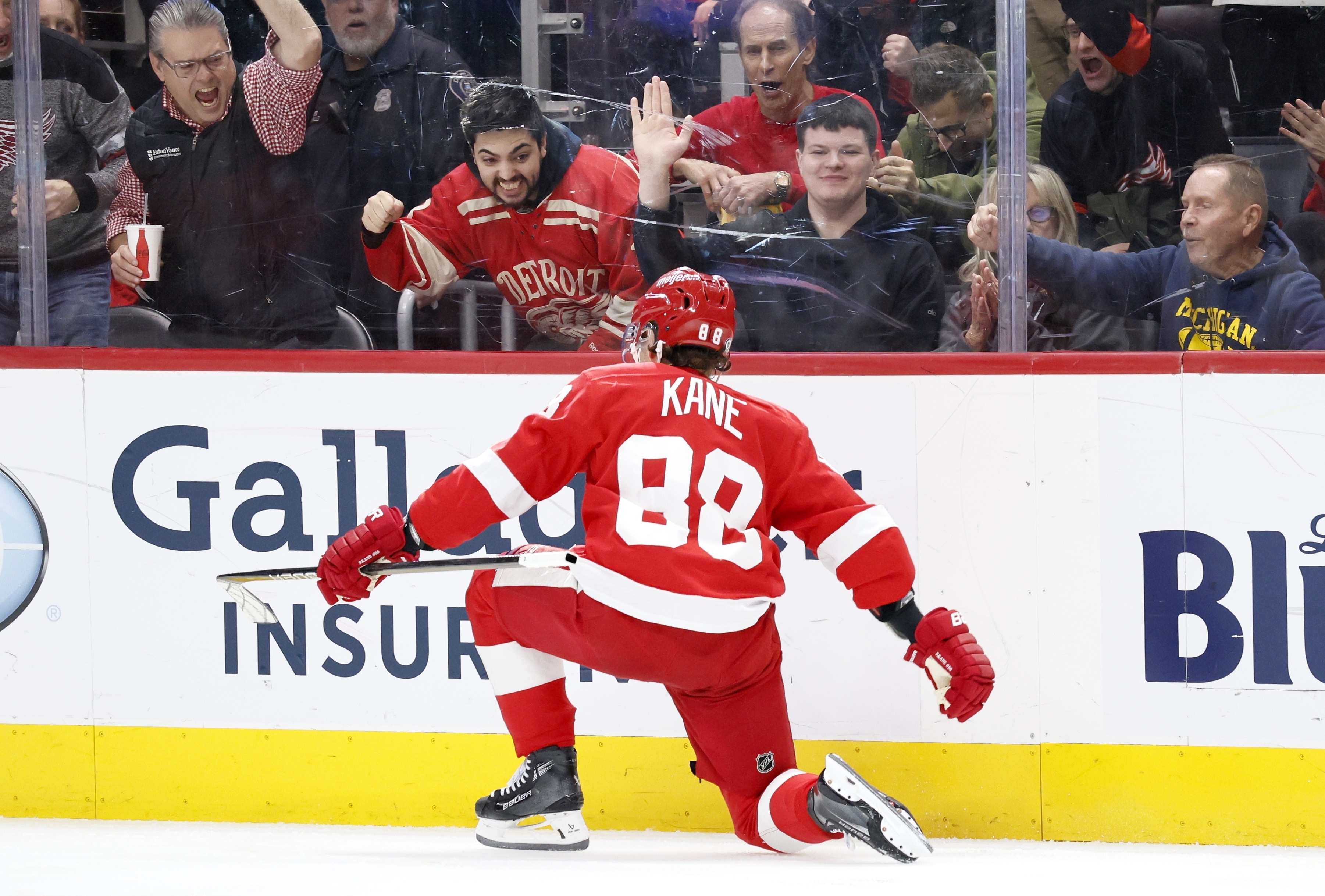 Detroit Red Wings right wing Patrick Kane (88) and fans celebrate his goal against the Philadelphia Flyers during the third period of an NHL hockey game Wednesday, Dec. 18, 2024, in Detroit.