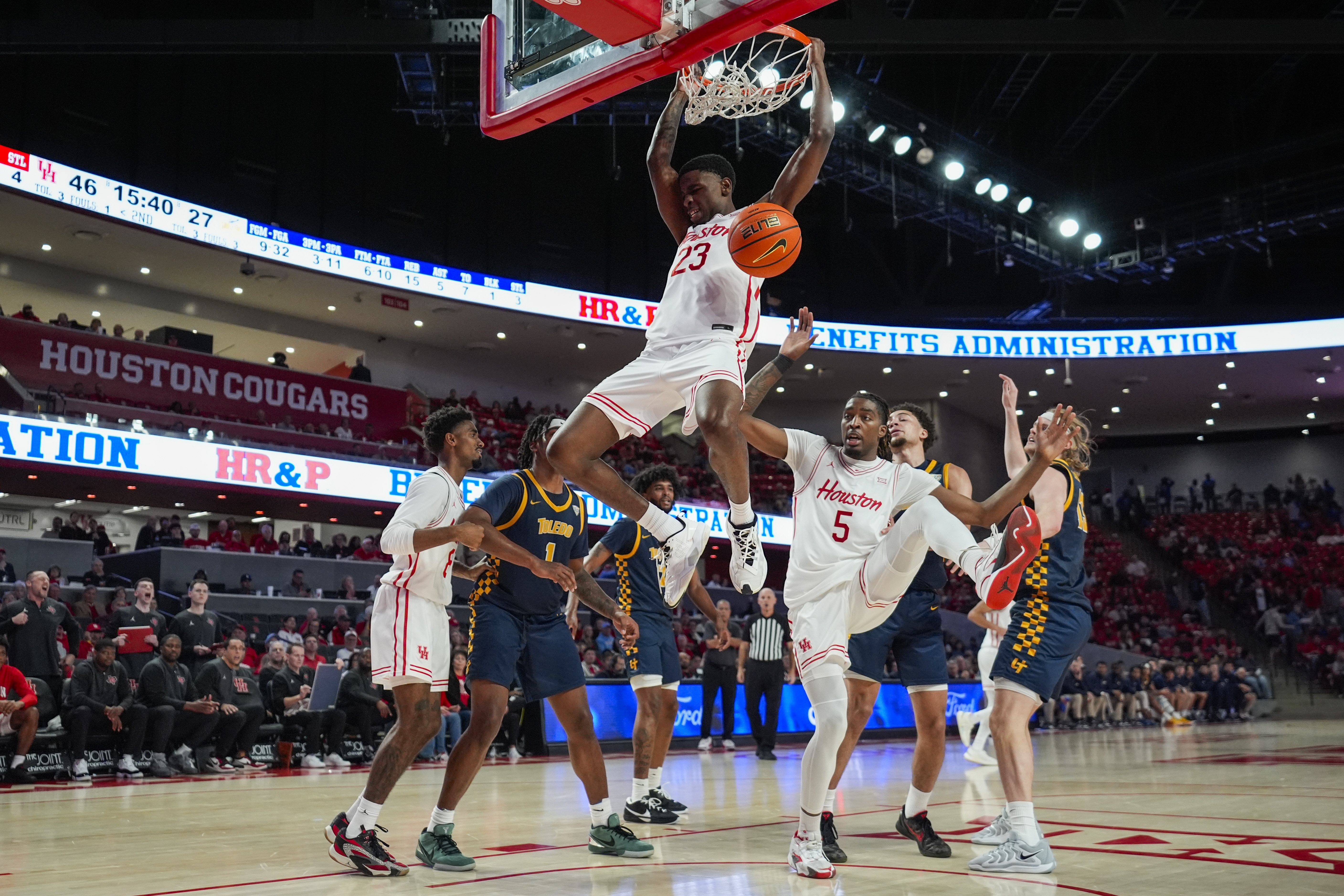 Houston guard Terrance Arceneaux (23) dunks during the second half of an NCAA college basketball game against the Toledo in Houston, Wednesday, Dec. 18, 2024.