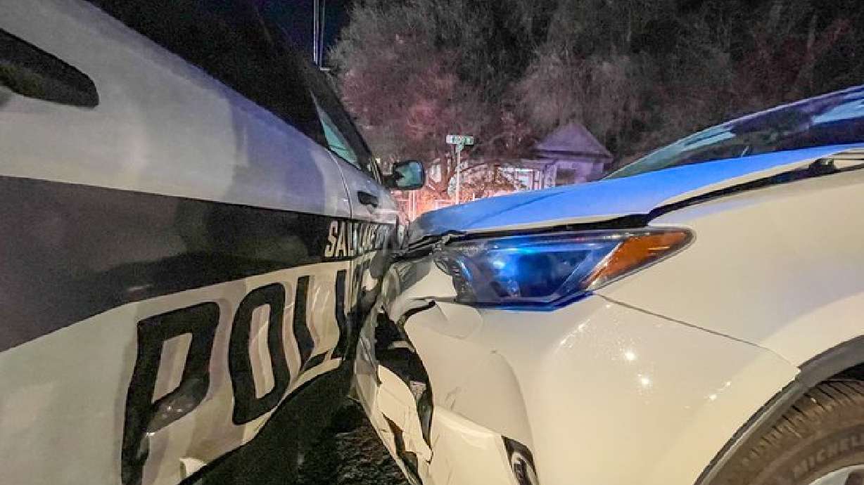 A suspected impaired driver crashed into a Salt Lake police patrol car while officers were investigating a reported drug problem.