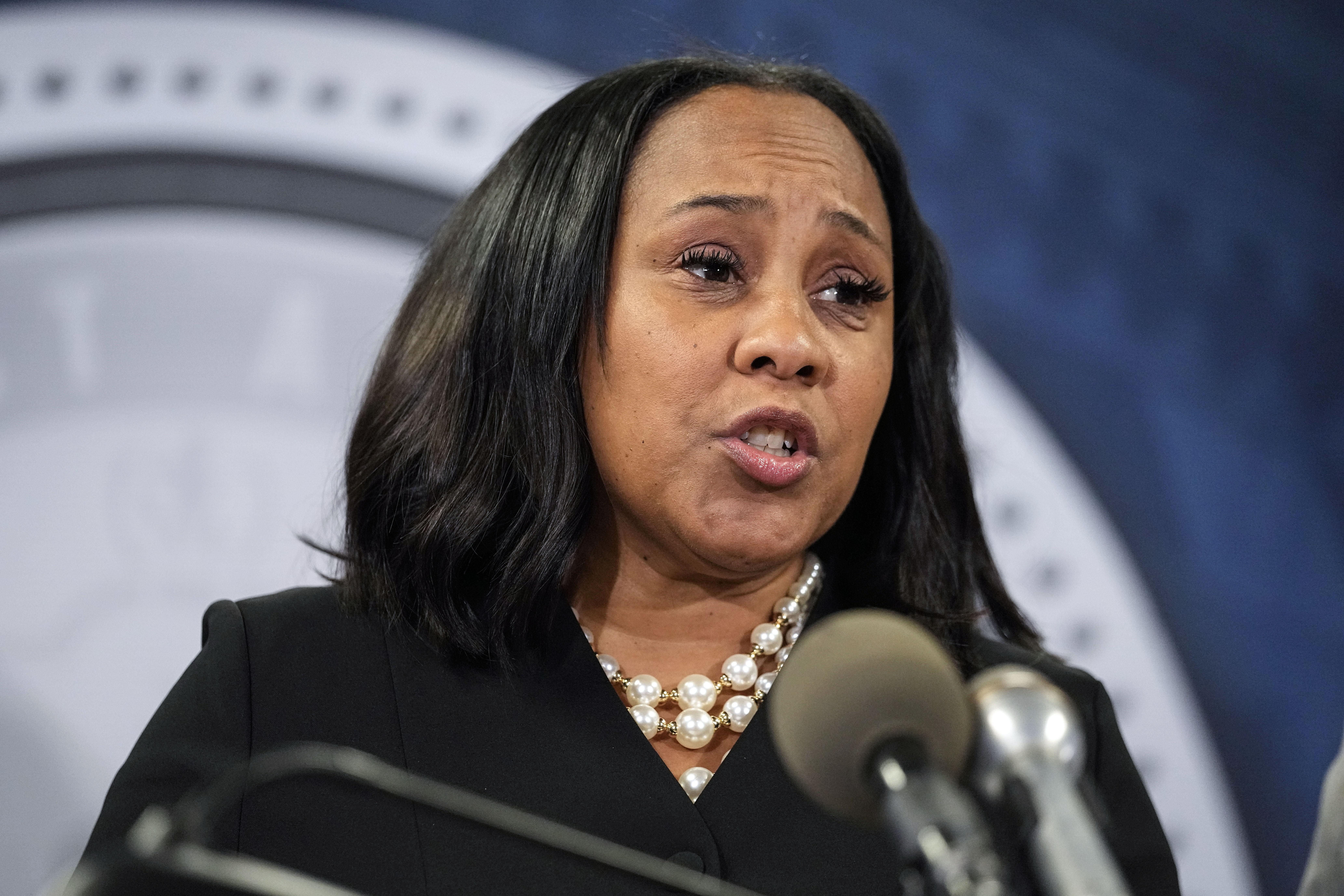 Fulton County District Attorney Fani Willis speaks during a news conference, Aug. 14, 2023, in Atlanta. A state appeals court has removed Willis from an election interference case against Donald Trump and others.
