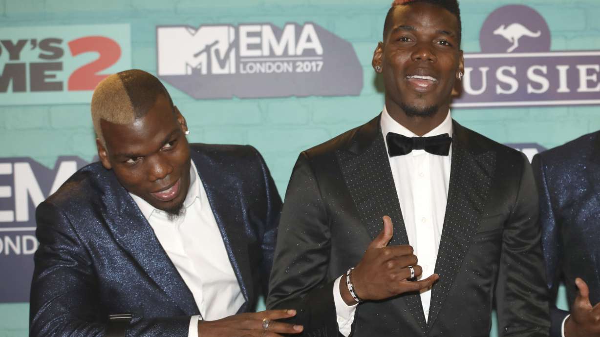 FILE - Soccer players Mathias Pogba, left, and Paul Pogba pose for photographers upon arrival at the MTV European Music Awards 2017 in London, Sunday, Nov. 12, 2017.