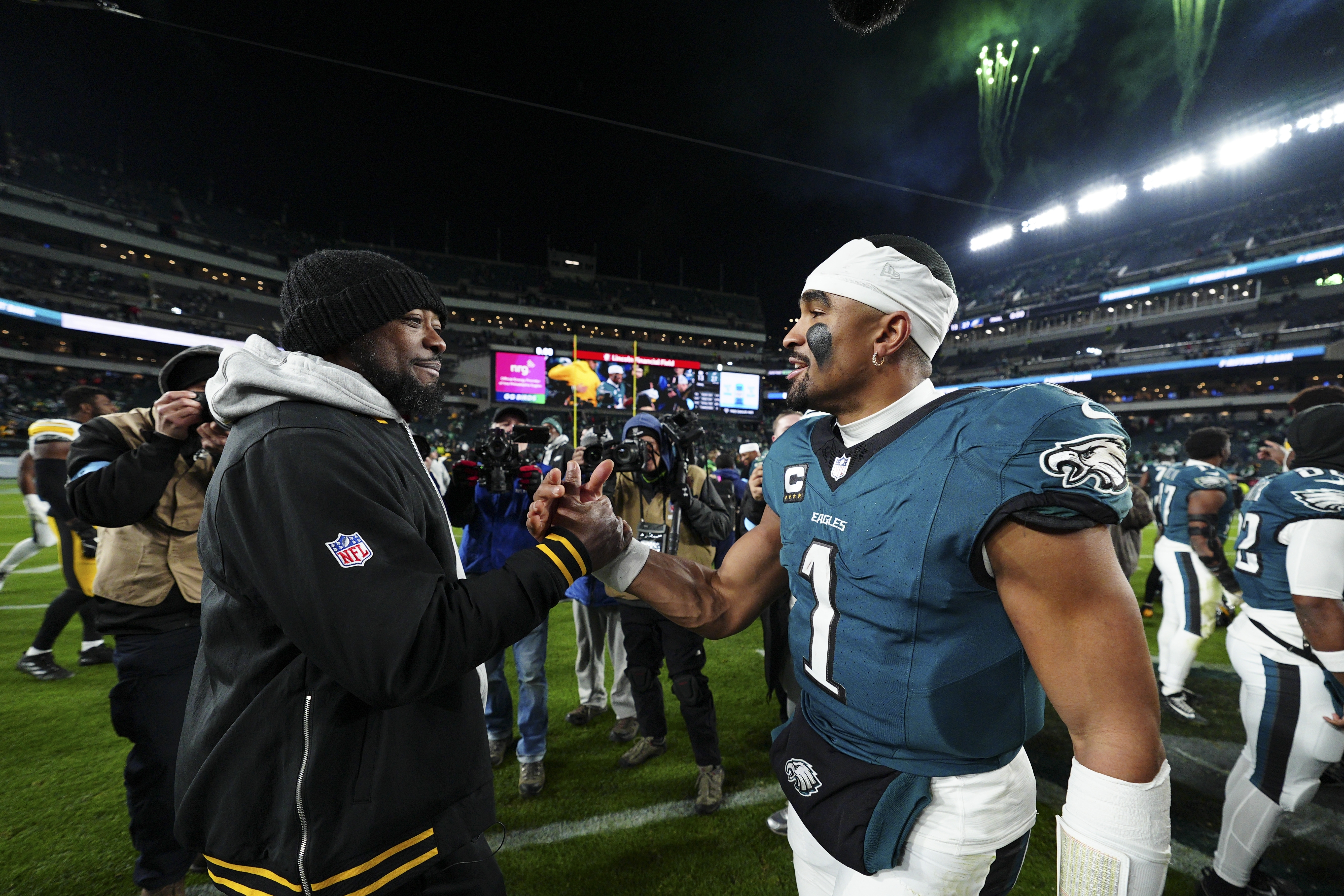 Philadelphia Eagles quarterback Jalen Hurts greets Pittsburgh Steelers head coach Mike Tomlin after an NFL football game Sunday, Dec. 15, 2024, in Philadelphia. 