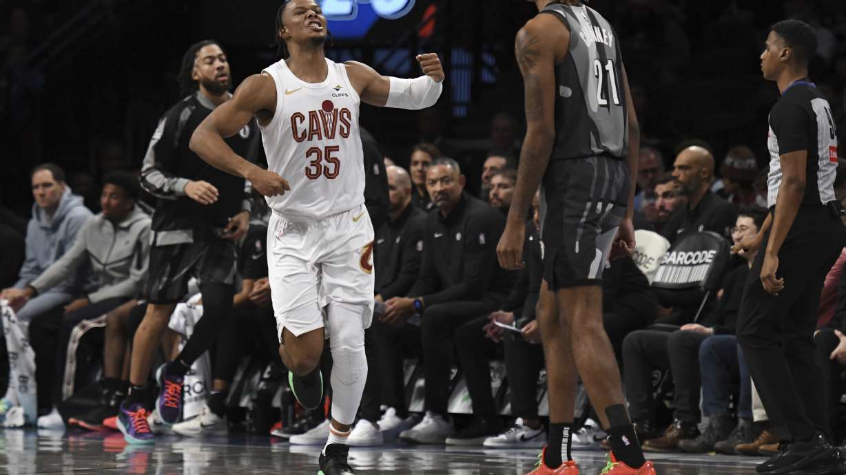 Cleveland Cavaliers' Isaac Okoro (35) reacts after scoring during the first half of an NBA basketball game against the Brooklyn Nets, Monday, Dec. 16, 2024, in New York.