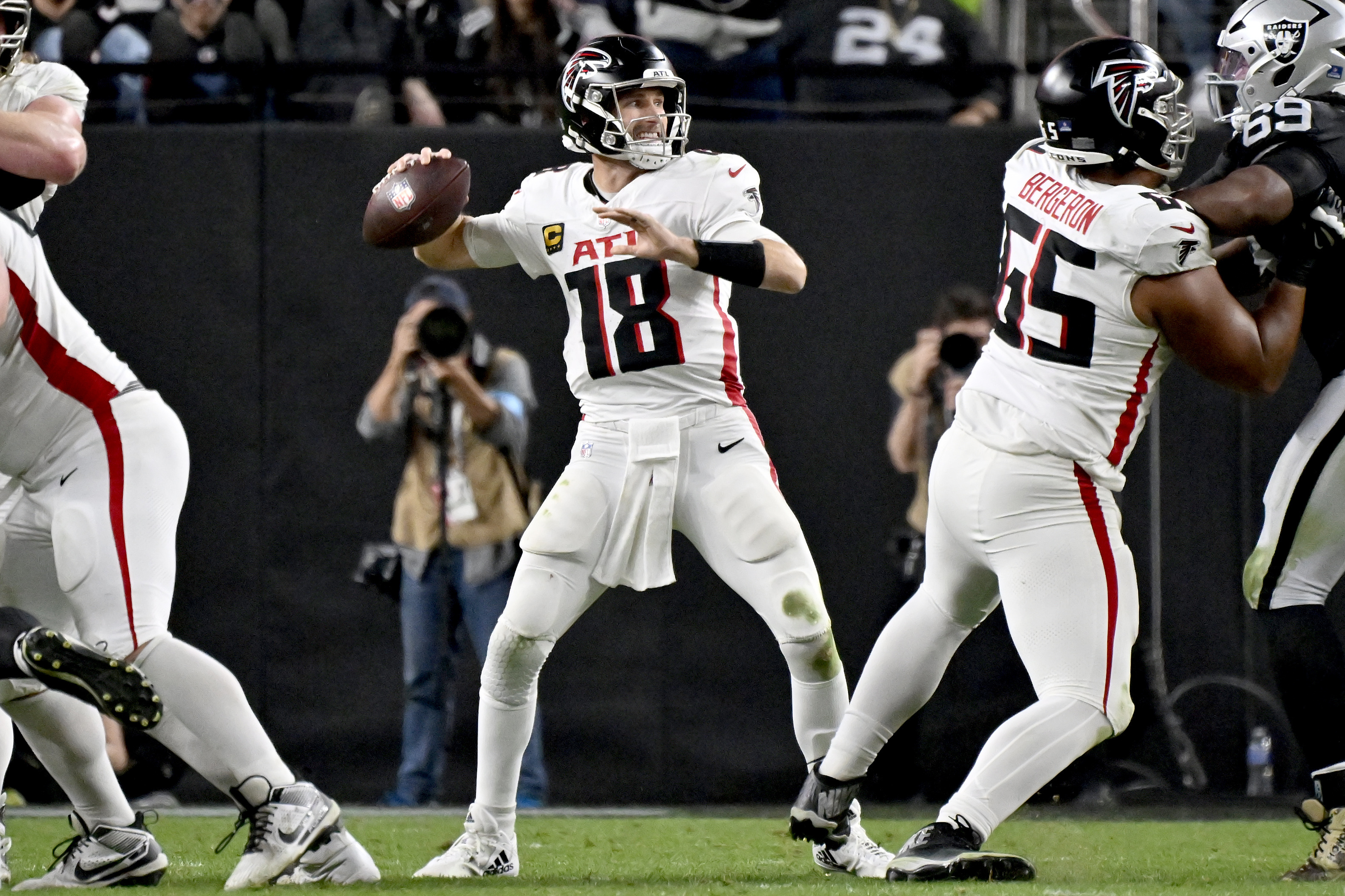 Atlanta Falcons quarterback Kirk Cousins (18) throws against the Las Vegas Raiders during the second half of an NFL football game, Monday, Dec. 16, 2024, in Las Vegas. 