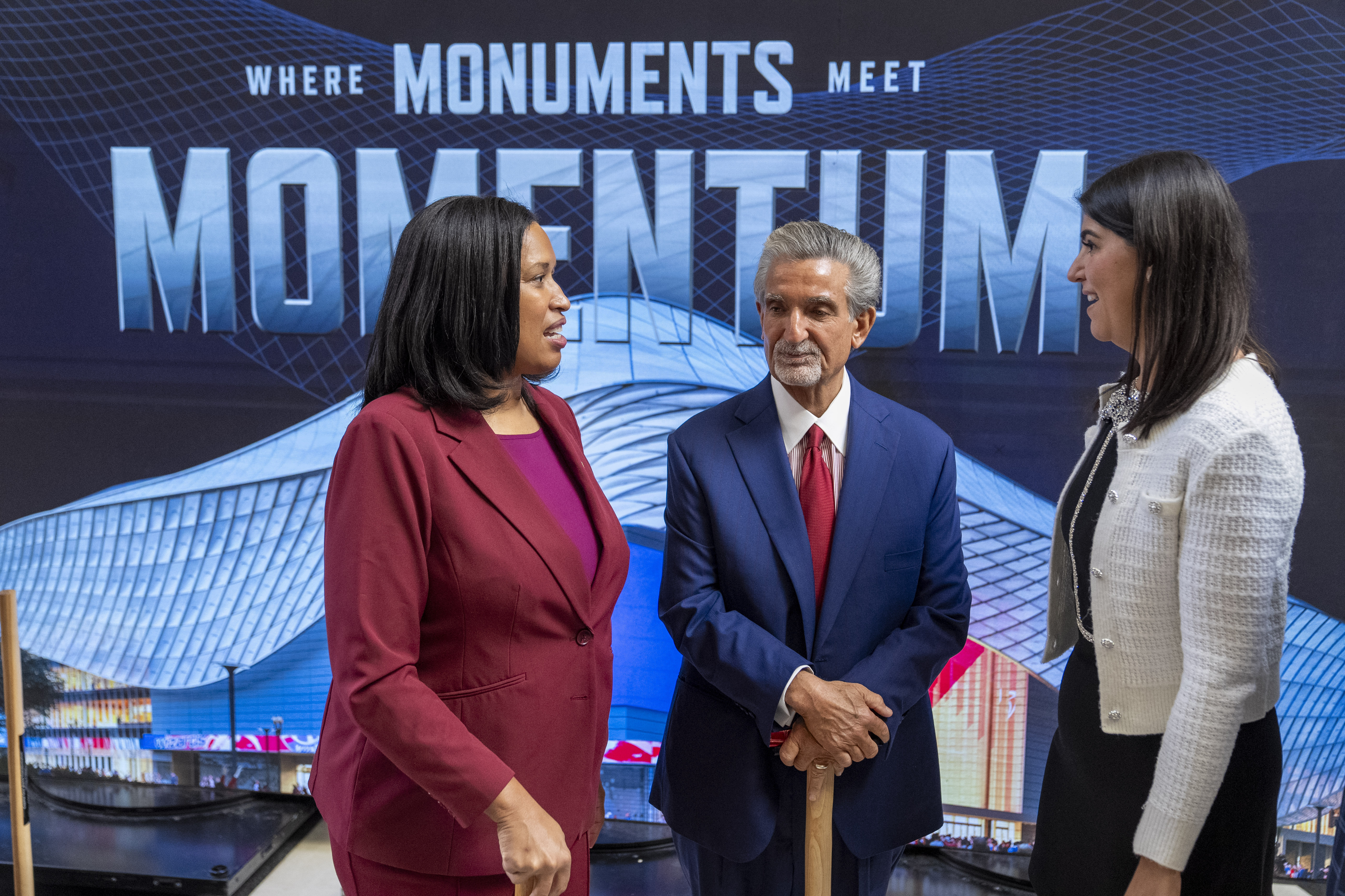 District of Columbia Mayor Muriel Bowser, left, Ted Leonsis, owner of the Washington Wizards NBA basketball team and Washington Capitals NHL hockey team, and District of Columbia Councilmember Brooke Pinto chat after an event announcing the start of work on a new Capital One Arena Gallery Place Atrium, Thursday, Dec. 19, 2024, in Washington.