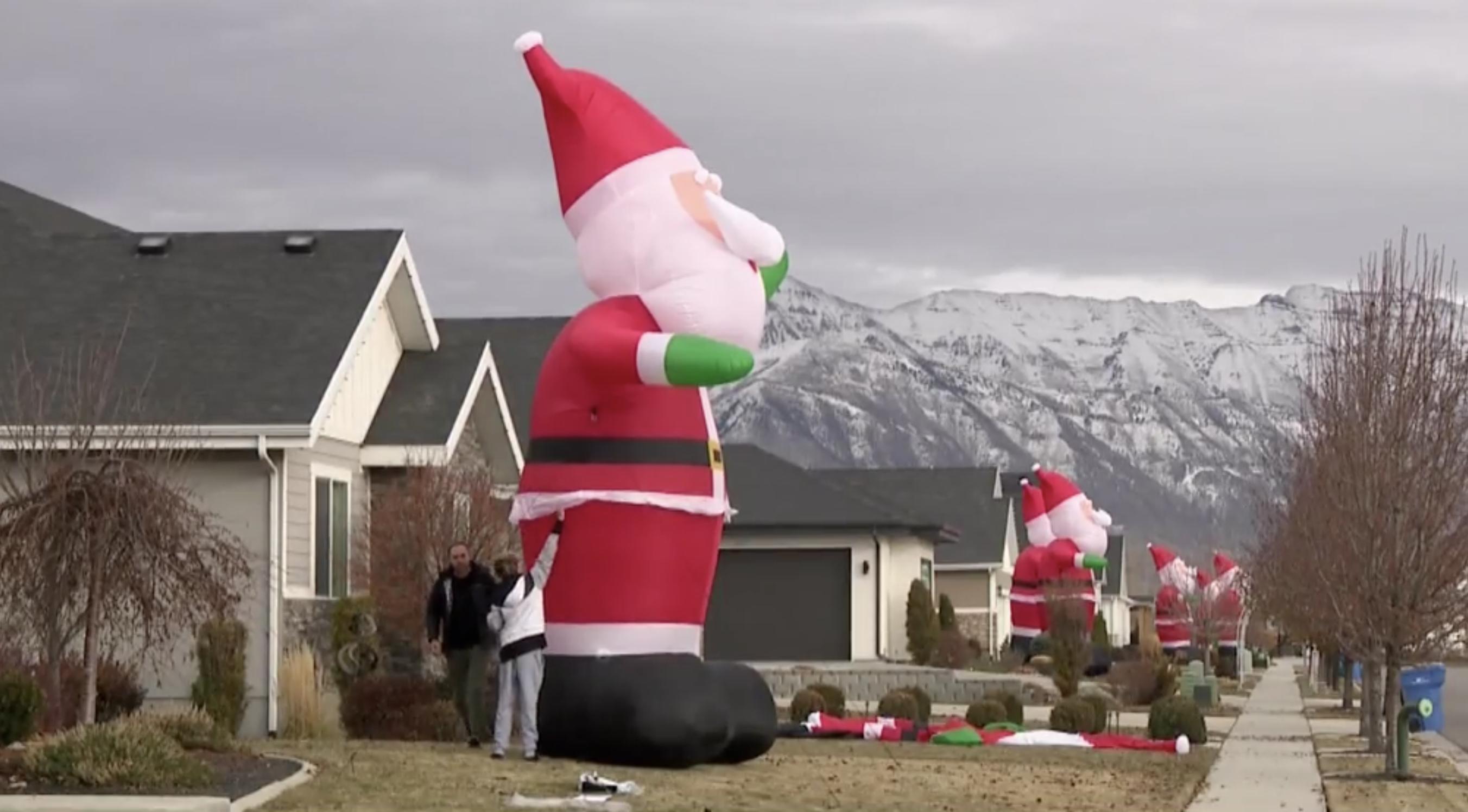 Inflatable Santas line Lehi streets