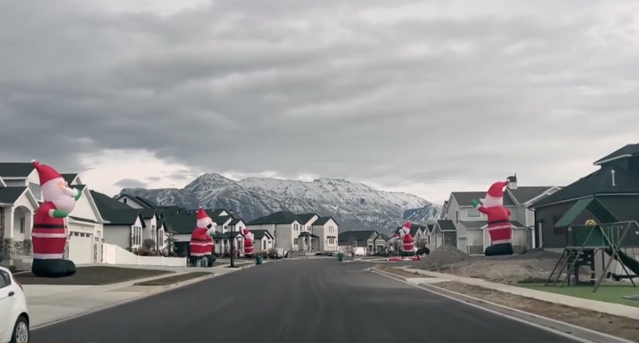 A Lehi neighborhood is in the spotlight thanks to their giant holiday display of inflatable Santas.