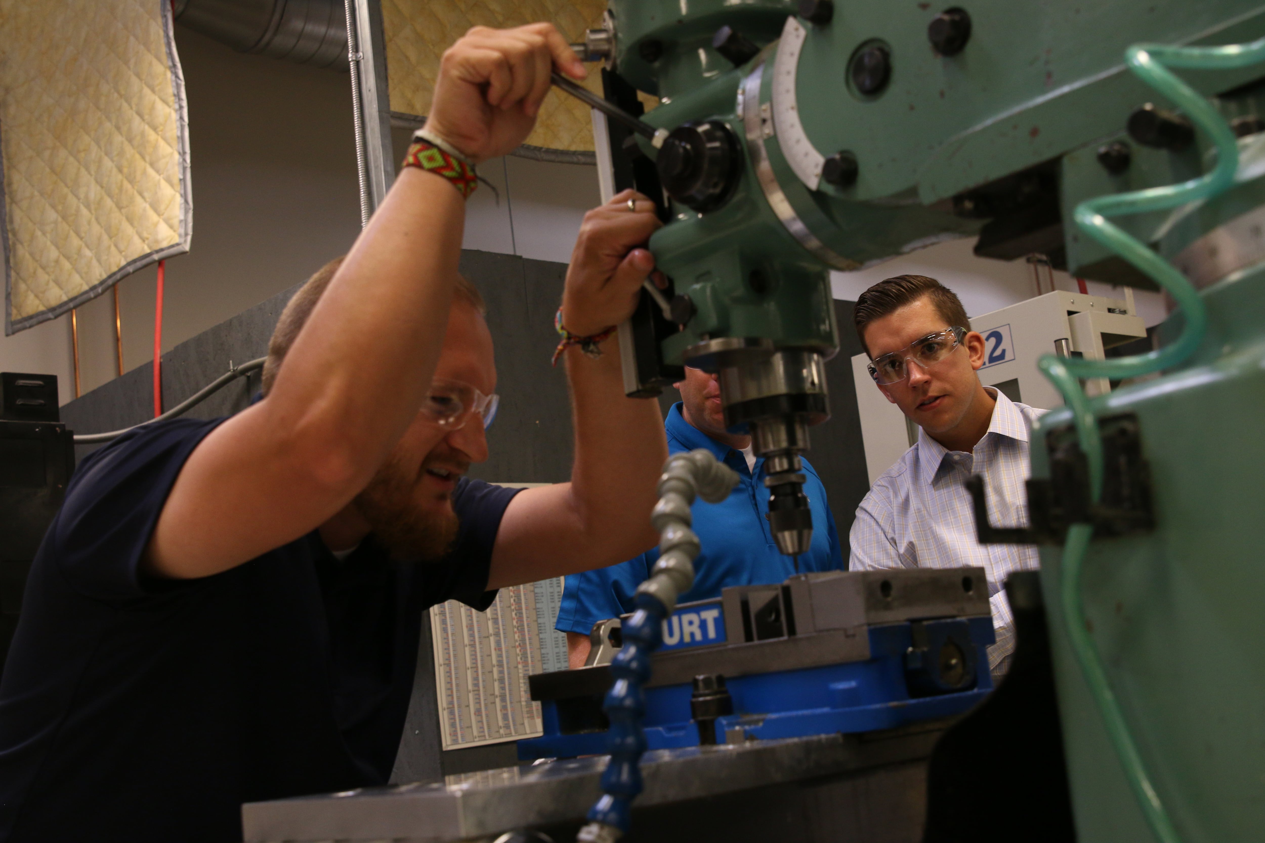 A University of Utah student consults with a worker as part of a visit sponsored by the university's Intermountain Industrial Assessment Center.