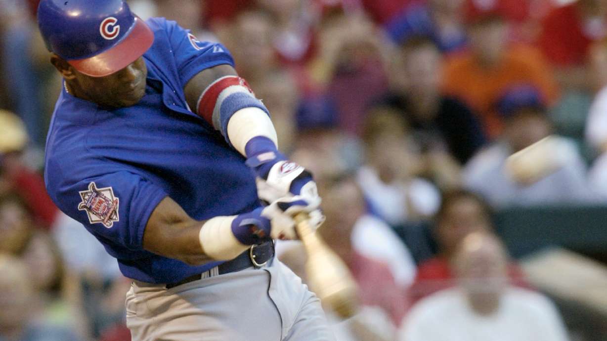 FILE - Chicago Cubs' Sammy Sosa connects for a three-run home run in the third ining against the St. Louis Cardinals Sunday, July 11, 2004 at Busch Stadium in St. Louis.