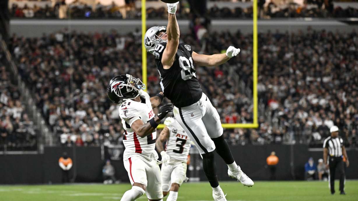 Las Vegas Raiders tight end Brock Bowers (89) can't make the catch as Atlanta Falcons cornerback Mike Hughes (21) defends during the first half of an NFL football game, Monday, Dec. 16, 2024, in Las Vegas.