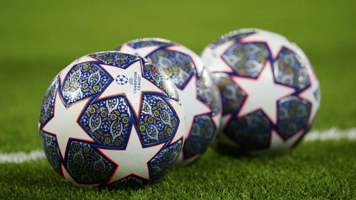 The Official UEFA Champions League match balls lie on the pitch ahead of the Champions League, round of 16, first leg soccer match between Liverpool and Real Madrid at the Anfield stadium in Liverpool, England, on Feb. 21, 2023.