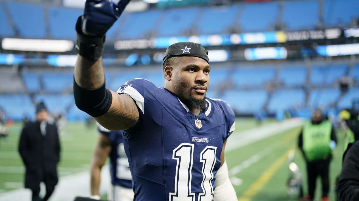 Dallas Cowboys linebacker Micah Parsons leaves the field after their win against the Carolina Panthers in an NFL football game, Sunday, Dec. 15, 2024, in Charlotte, N.C.