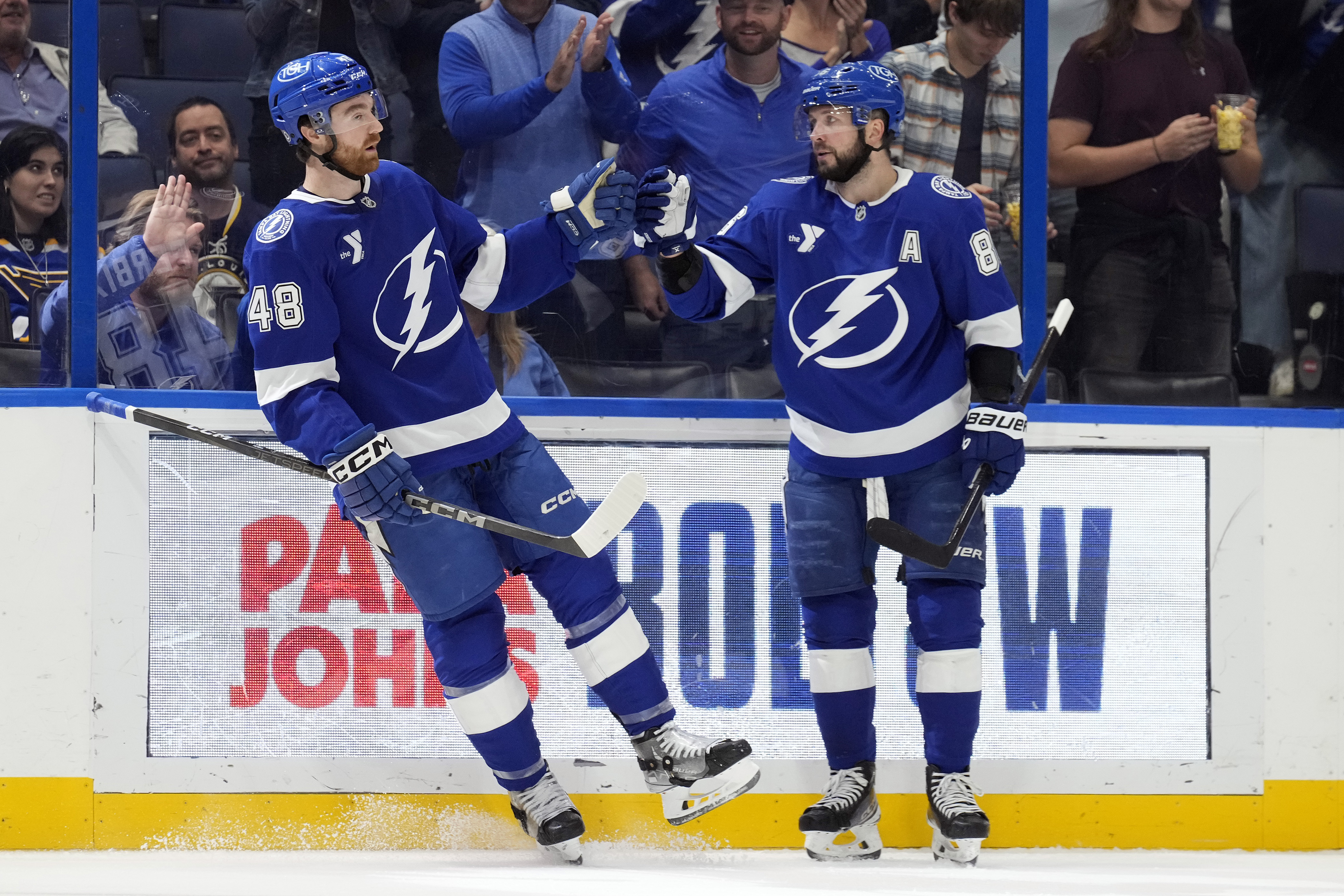 Tampa Bay Lightning defenseman Nick Perbix (48) celebrates his goal against the St. Louis Blues with right wing Nikita Kucherov (86) during the second period of an NHL hockey game Thursday, Dec. 19, 2024, in Tampa, Fla. 