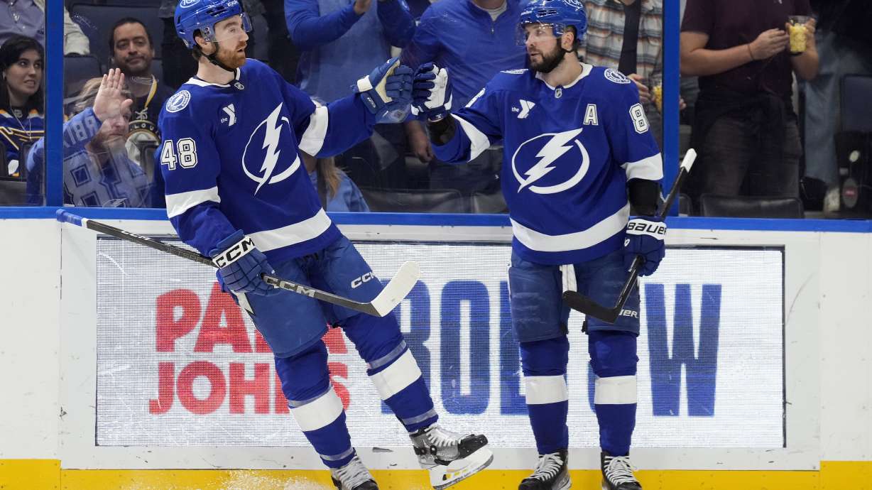 Tampa Bay Lightning defenseman Nick Perbix (48) celebrates his goal against the St. Louis Blues with right wing Nikita Kucherov (86) during the second period of an NHL hockey game Thursday, Dec. 19, 2024, in Tampa, Fla.