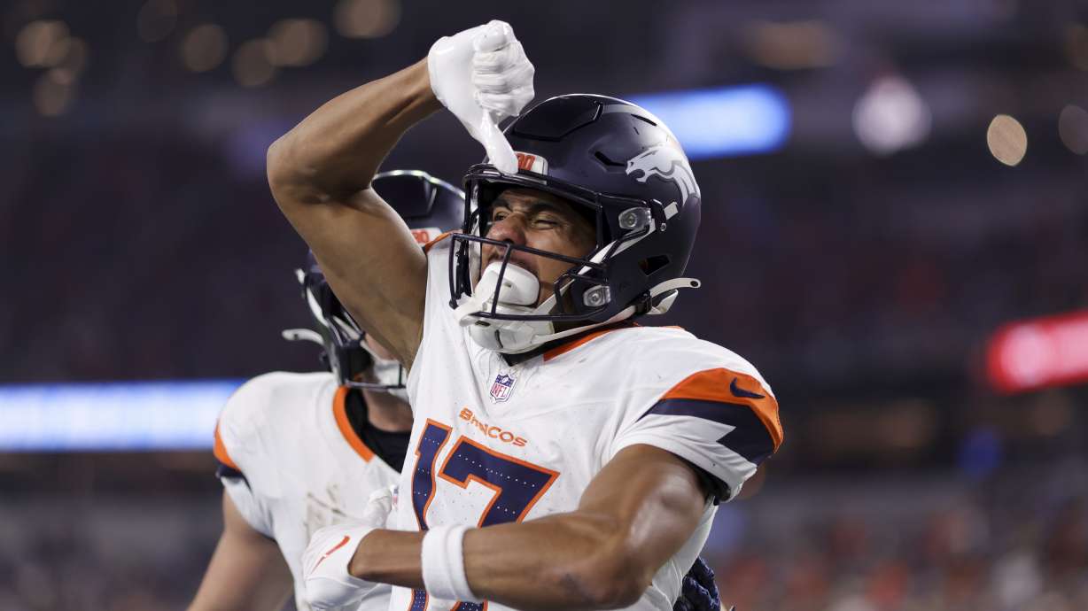 Denver Broncos wide receiver Devaughn Vele (17) celebrates after his touchdown catch during the first half an NFL football game against the Los Angeles Chargers, Thursday, Dec. 19, 2024, in Inglewood, Calif.