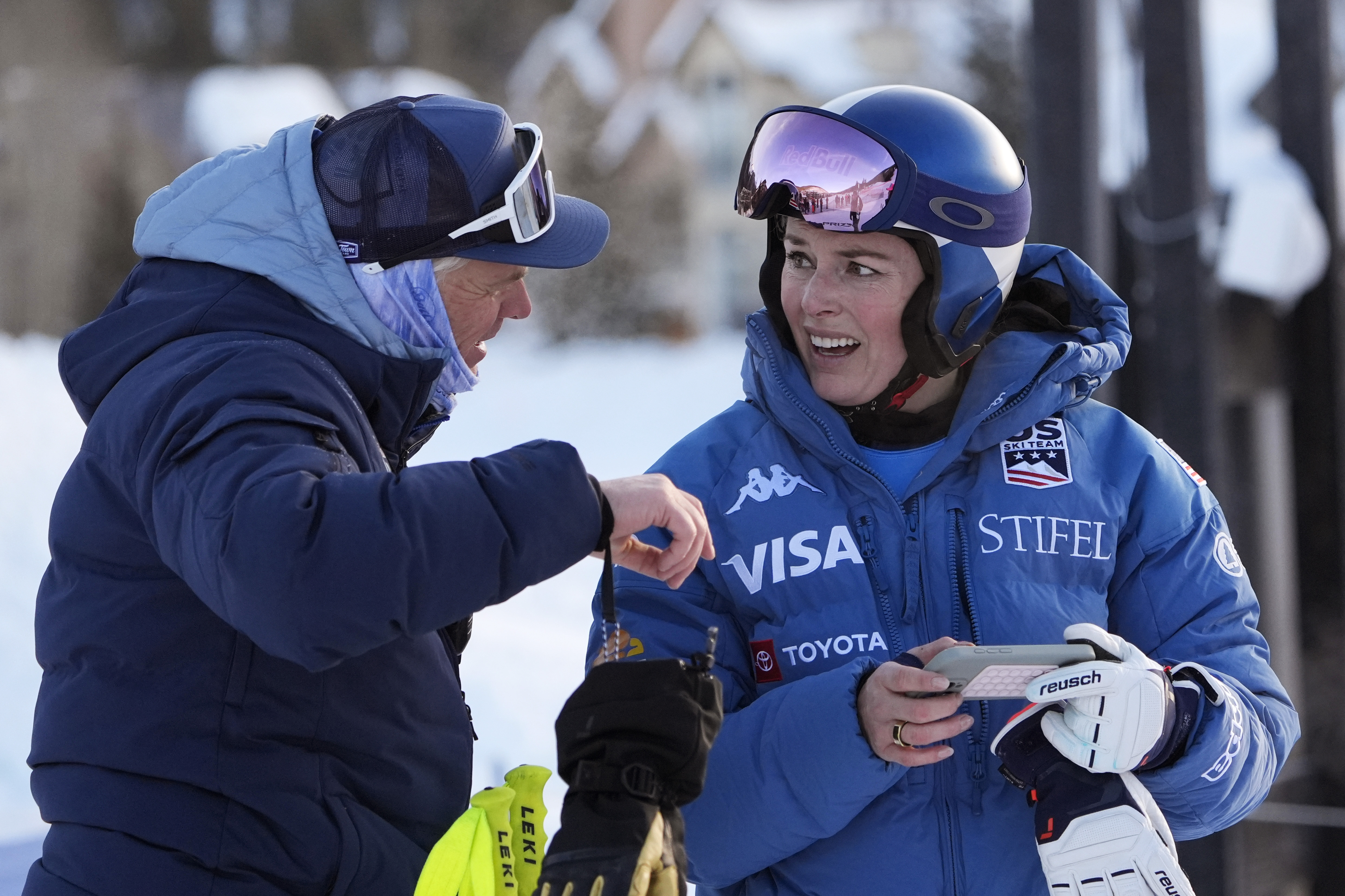 Lindsey Vonn talks with a coach after competing in a Super G skiing race at Copper Mountain Ski Resort, Sunday, Dec. 8, 2024, in Copper Mountain, Colo. 