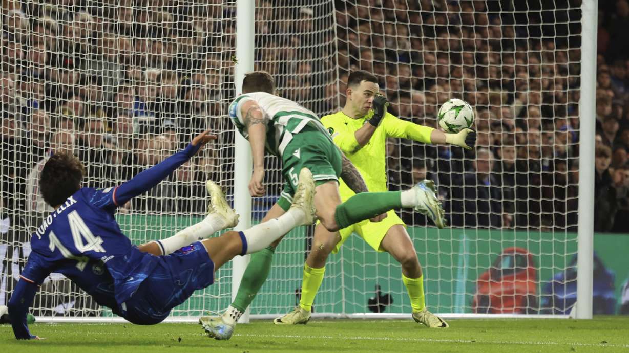 Shamrock Rovers' goalkeeper Leon Poehls, back, blocks a shot by Chelsea's Joao Felix during the Europa Conference League opening phase soccer match between Chelsea and Shamrock Rovers at Stamford Bridge stadium in London, Thursday, Dec. 19, 2024.