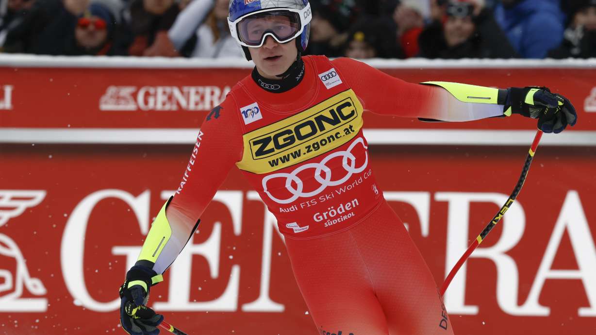 Switzerland's Marco Odermatt gets to the finish area after completing an alpine ski, men's World Cup Super-G in Val Gardena, Italy, Friday, Dec. 20, 2024.